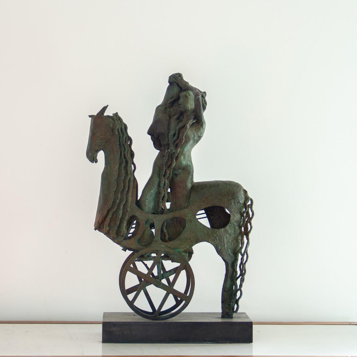 A Spanish bronze table sculpture by Oscar Estruga titled 'Soporte para Ganimedes', which translates directly to 'support for Ganymedes'. This sculpture is set on a steel base and has a lovely verdisgris patina, circa 1979, signed

Oscar Estrugo is