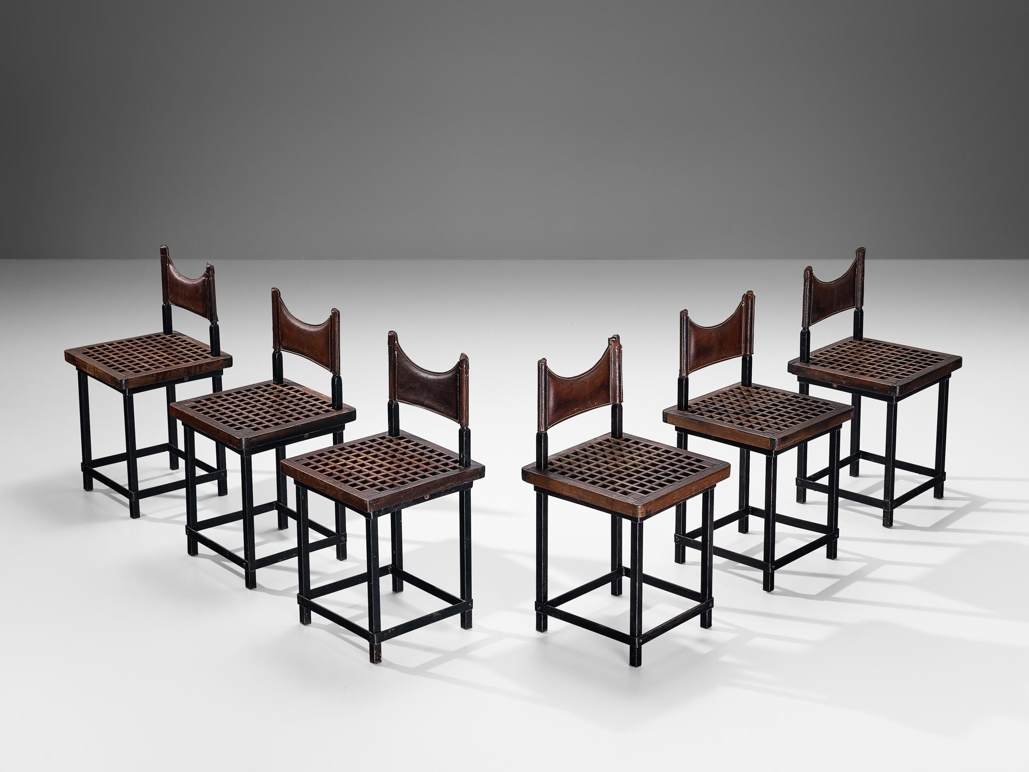 Set of six dining chairs, iron, leather, stained beech, Spain, 1950s.

These distinctive chairs of Spanish origin reflect the stylistic traits of Brutalism. This movement is an architectural style started from the mid-20th century, aiming for raw,