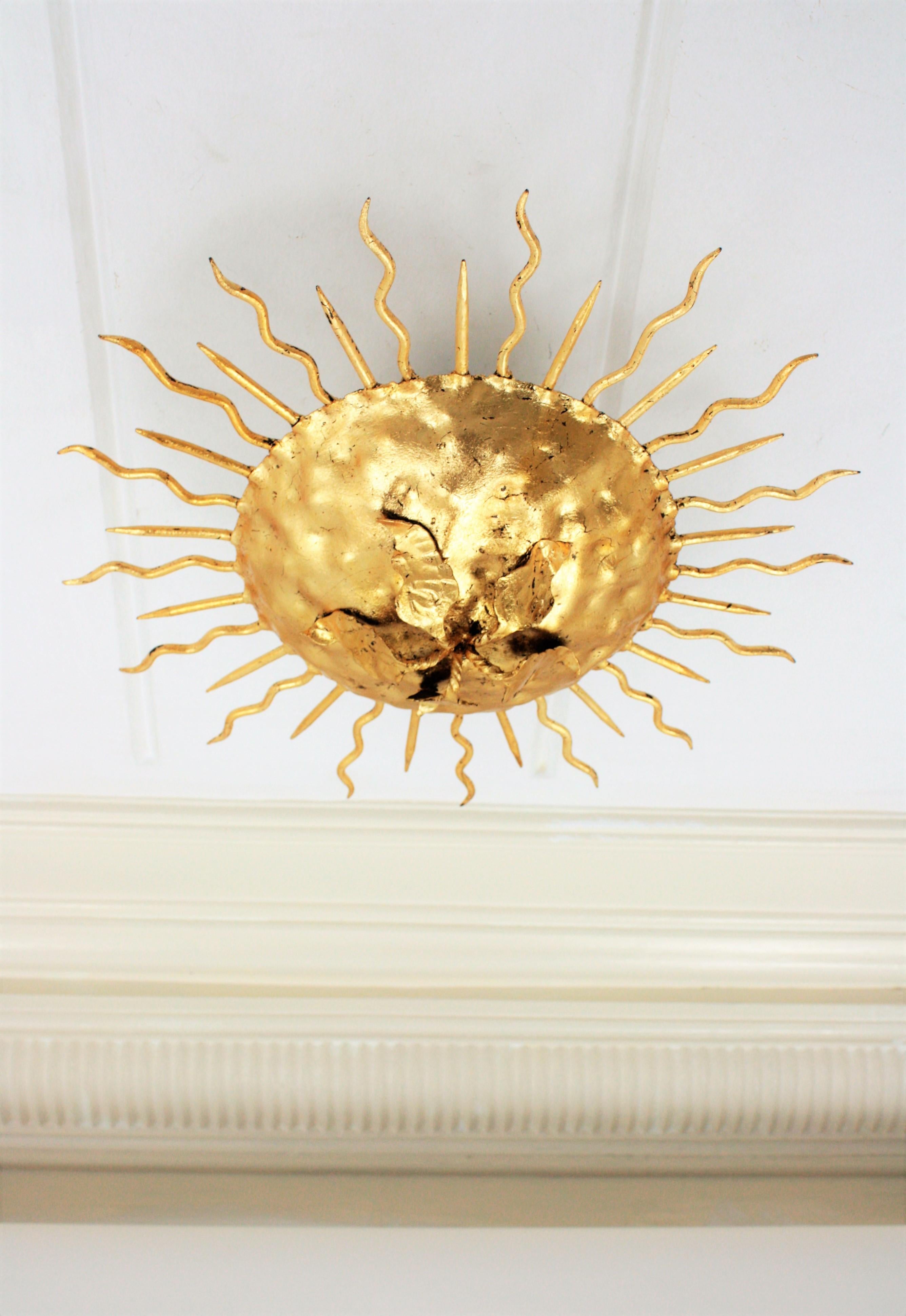 Spanish Sunburst Brutalist Light Fixture in Gilt Iron with Flower Motif For Sale