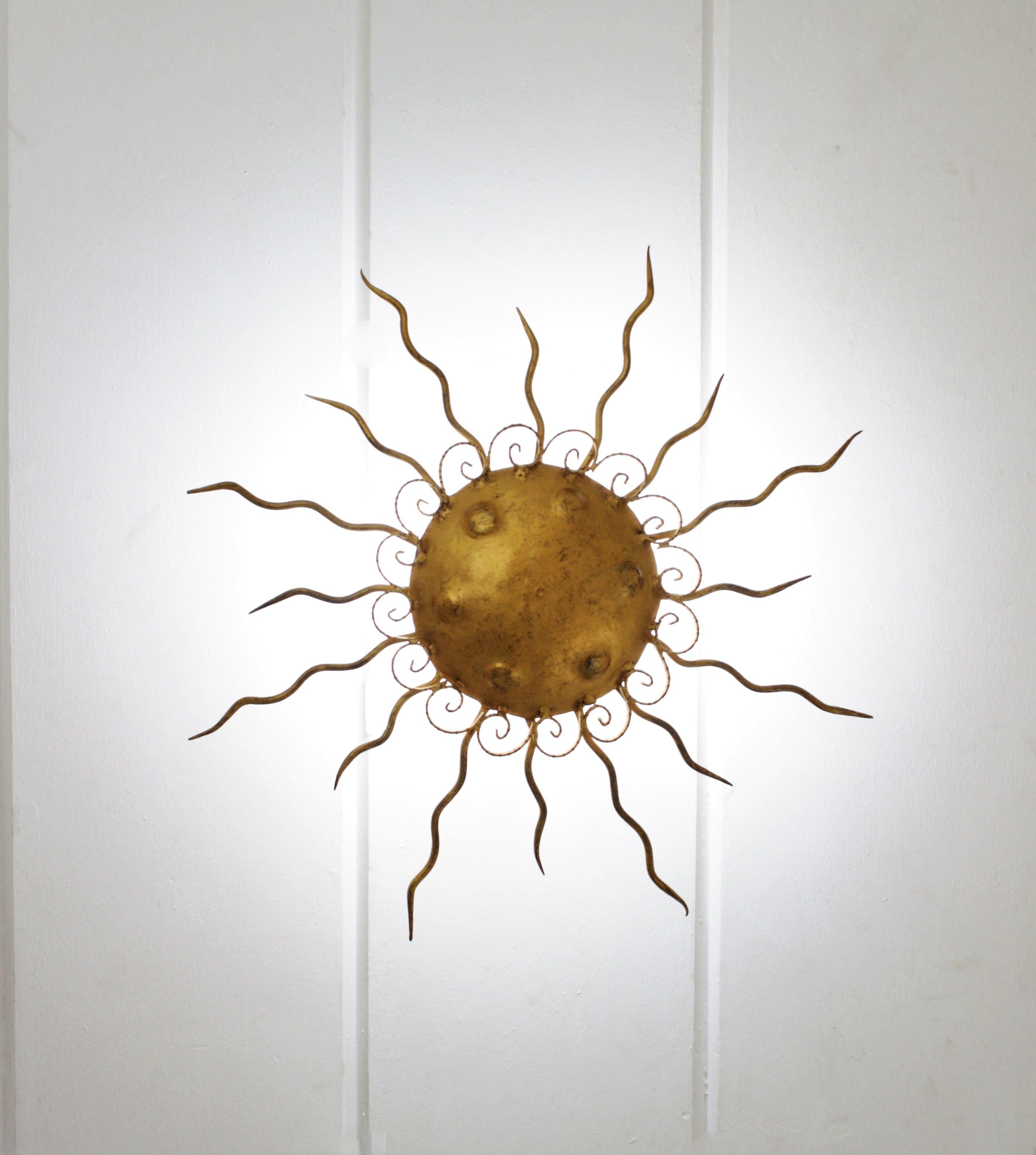 Metal Spanish Brutalist Sunburst Light Fixture in Wrought Gilt Iron For Sale