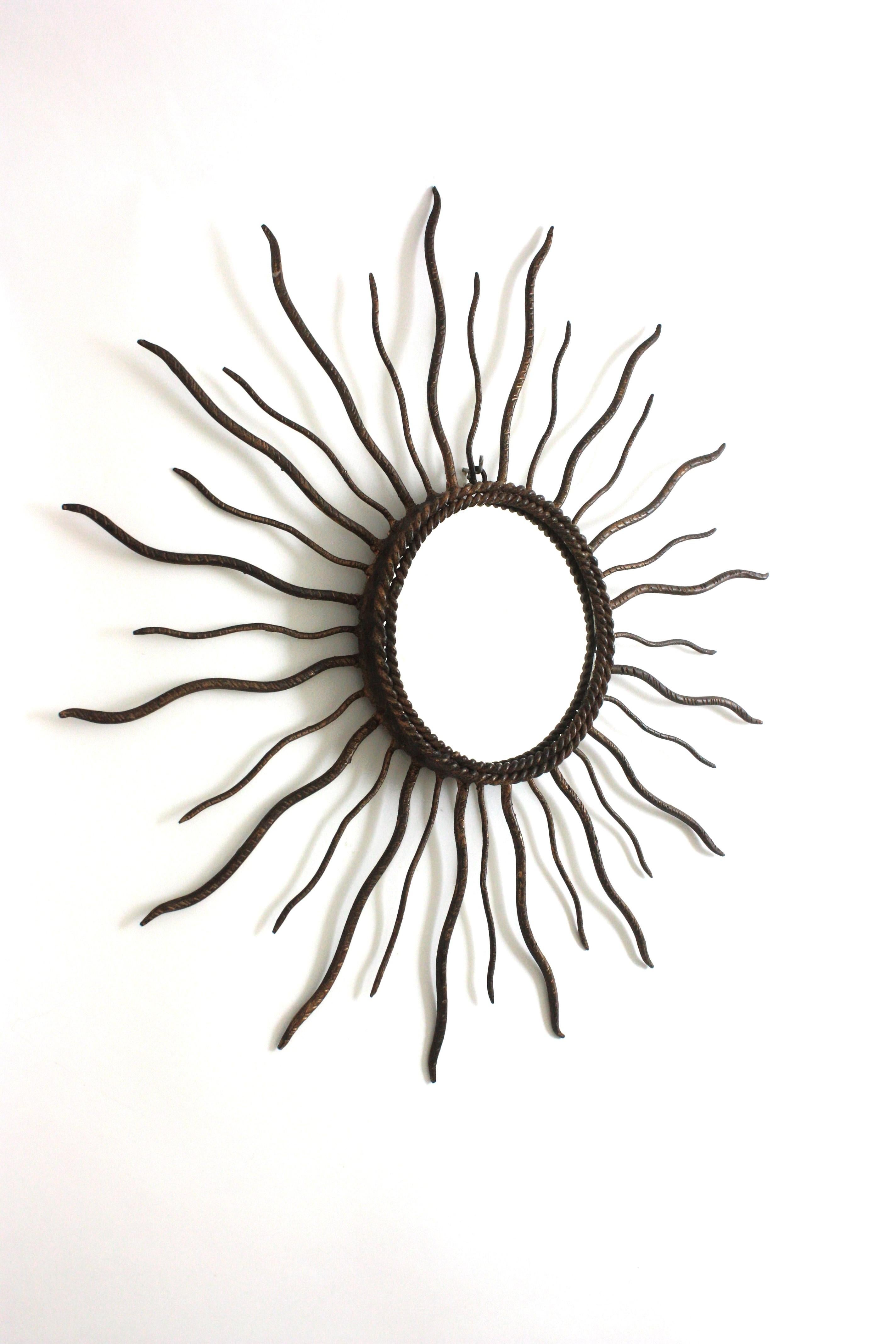 Metal Spanish Brutalist Sunburst Mirror in Parcel Gilt Iron, 1950s For Sale