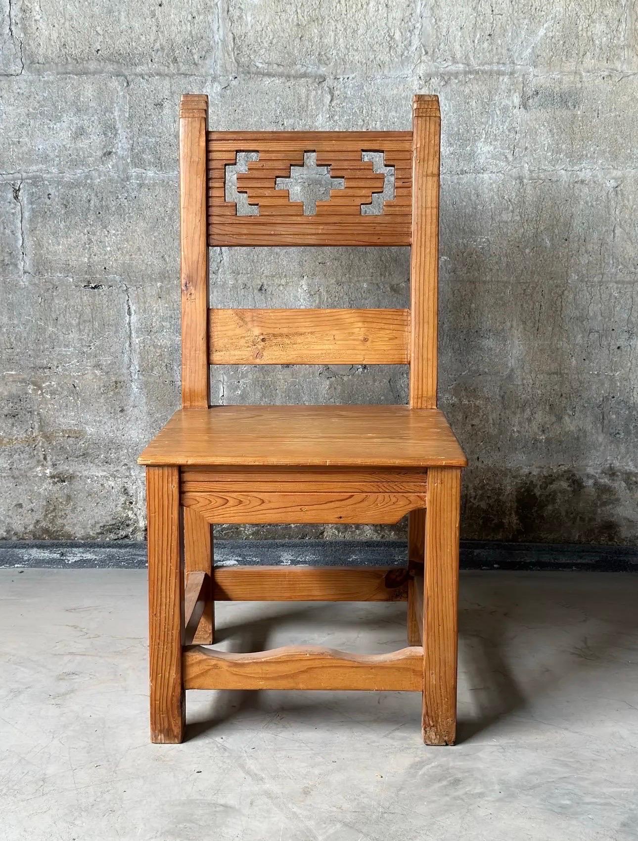 Six Spanish dining chairs made pine. Gorgeous carvings on the chair posts and seat back splat. Clean lines and subtle curves on the box stretcher.