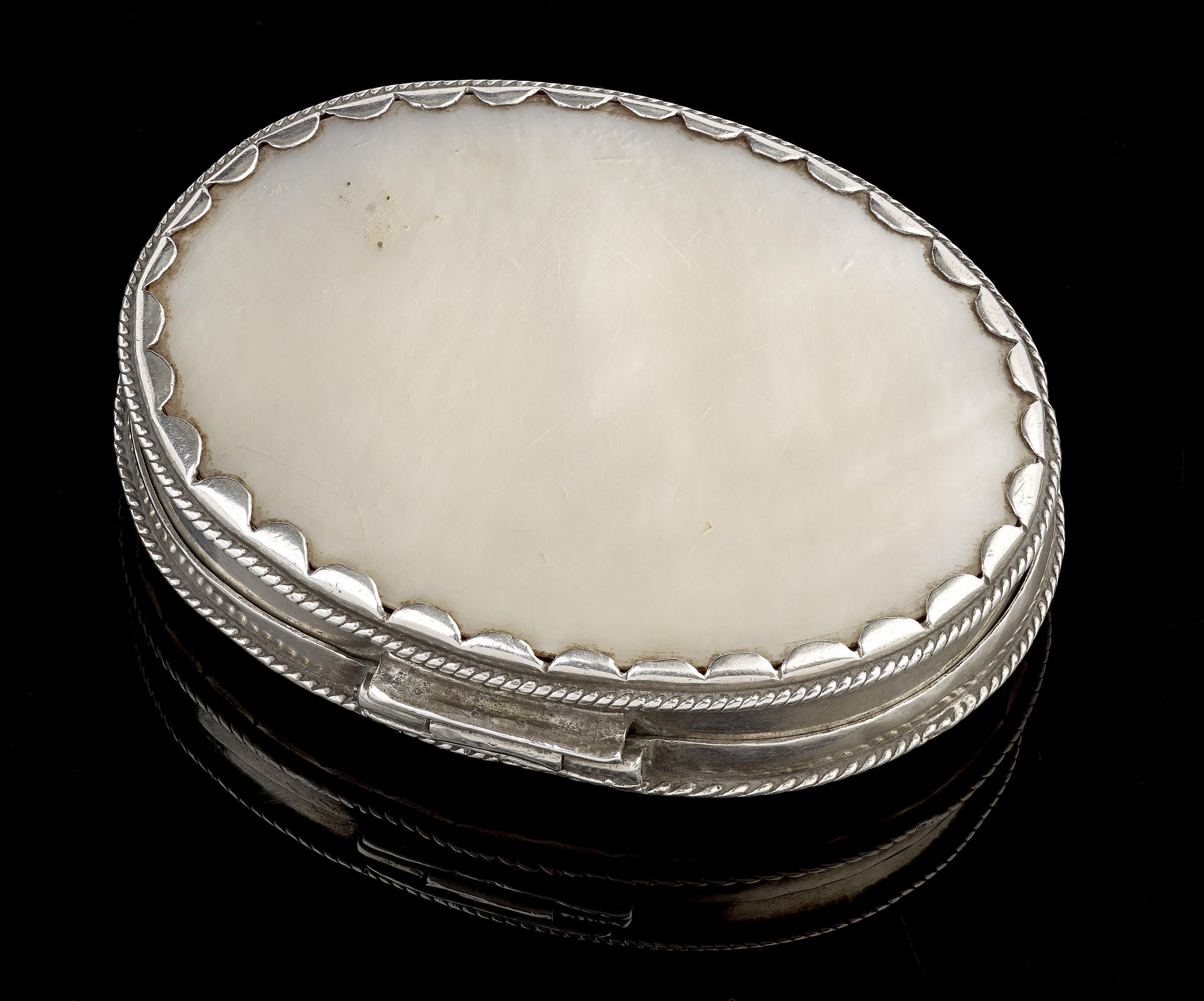 A little carved mother of pearl box with silver mounts, 17th century Spanish Colonial; probably used by a travelling missionary to carry communion bread.