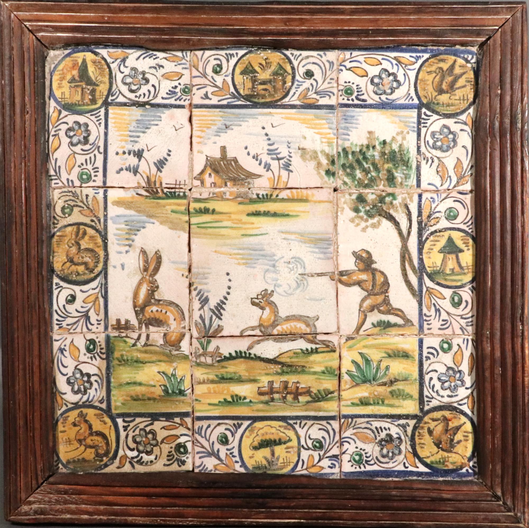 Spanish Catalan Faience Hunting Subject Tile Picture
Late 18th Century

The framed picture depicts a huntsman firing his gun at a hare with his dog before him in a landscape with a house in the background on a set of nine tiles.  The outer edge of