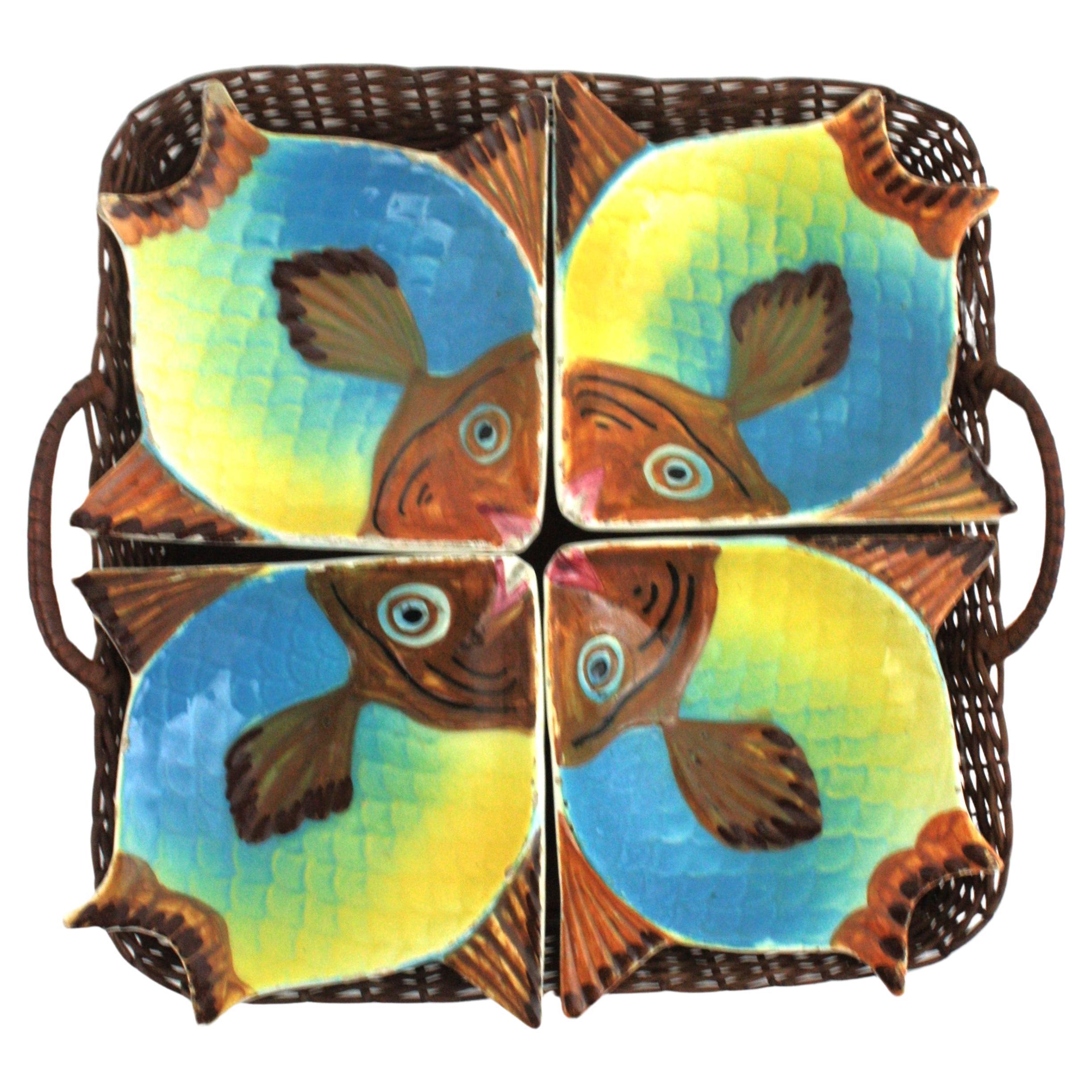 Eye-catching set of 4 small fish shaped bowls on a rattan serving tray, Spain, 1950s
The set is comprised by: 
4 colorful hand-painted ceramic fish dishes
1 hand-woven rattan basket tray
Manufacturer's marks underneath.
On sale as a set.
This set