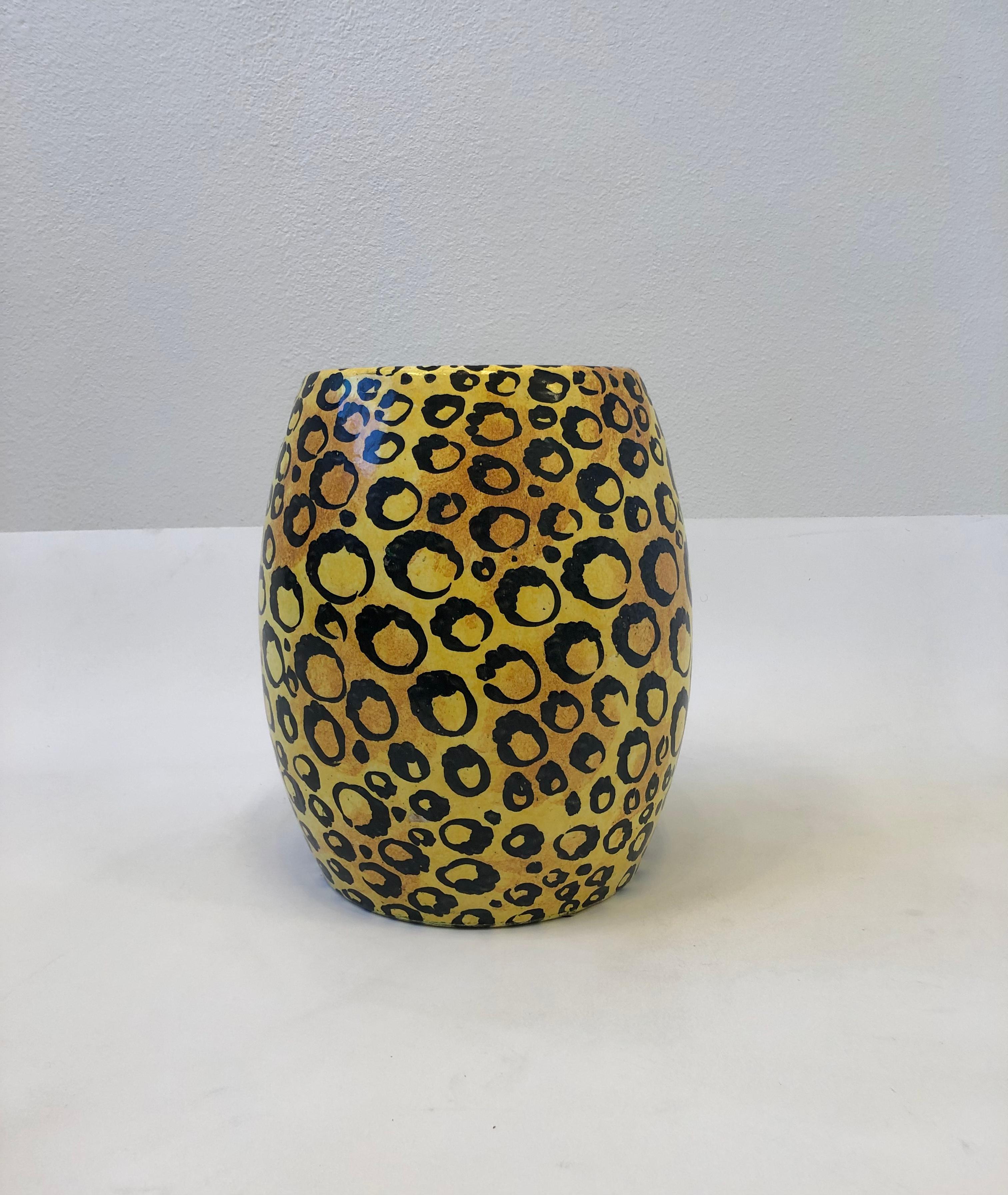 1960’s Spanish ceramic with hand painted leopard print glazed drum table. 
It has two oval holes on the sides to use for lifting and moving. 
Marked Spain in the inside, It has a slight stress crack (see detail photos). 
Measurements: 15.5” high