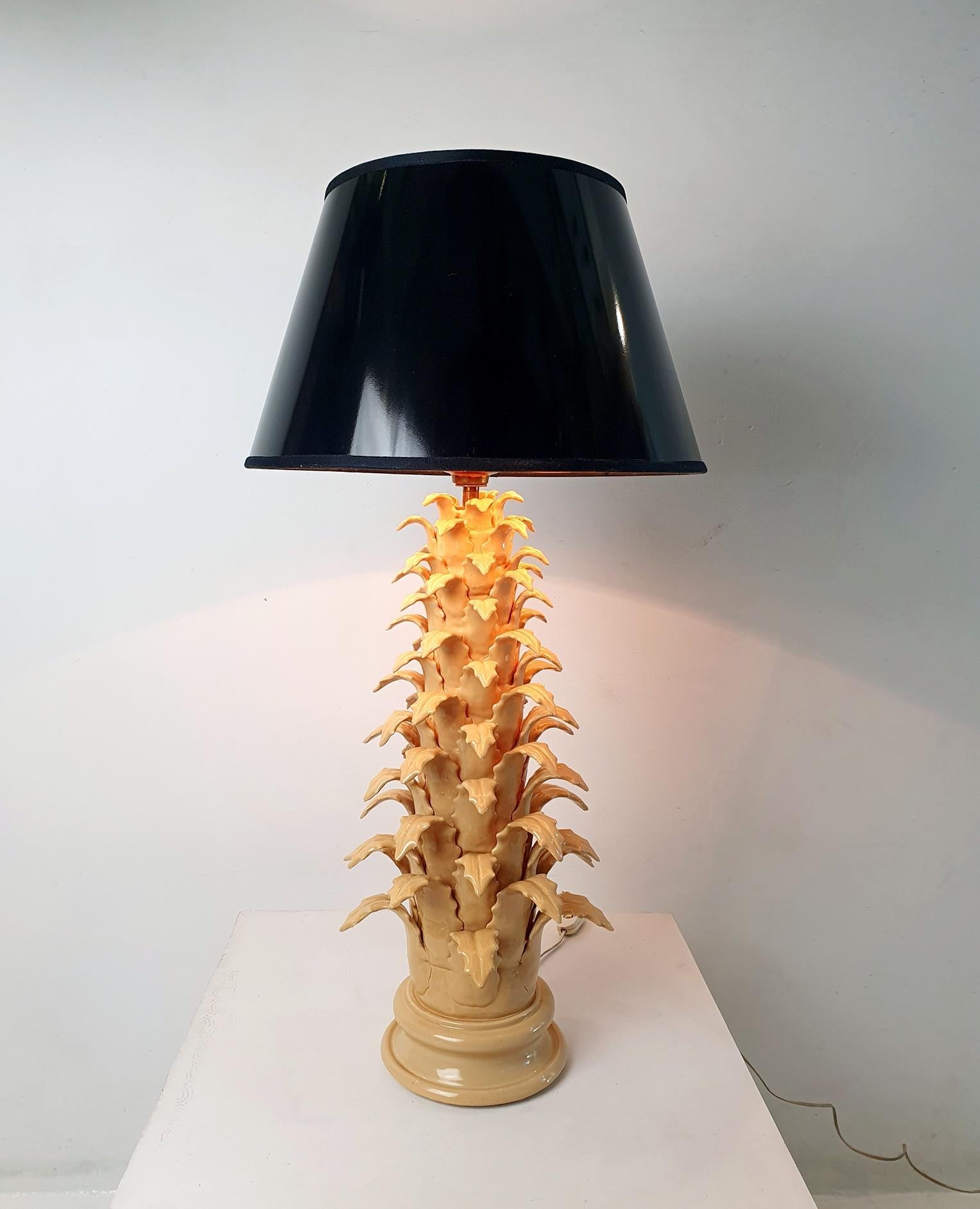 This is a 1970s nude colored ceramic table lamp produced in Spain. It has been paired with black lacquer lampshade witch is gold colored inside to reflect a golden light. It is very tall and is a decorative piece in it's own right.