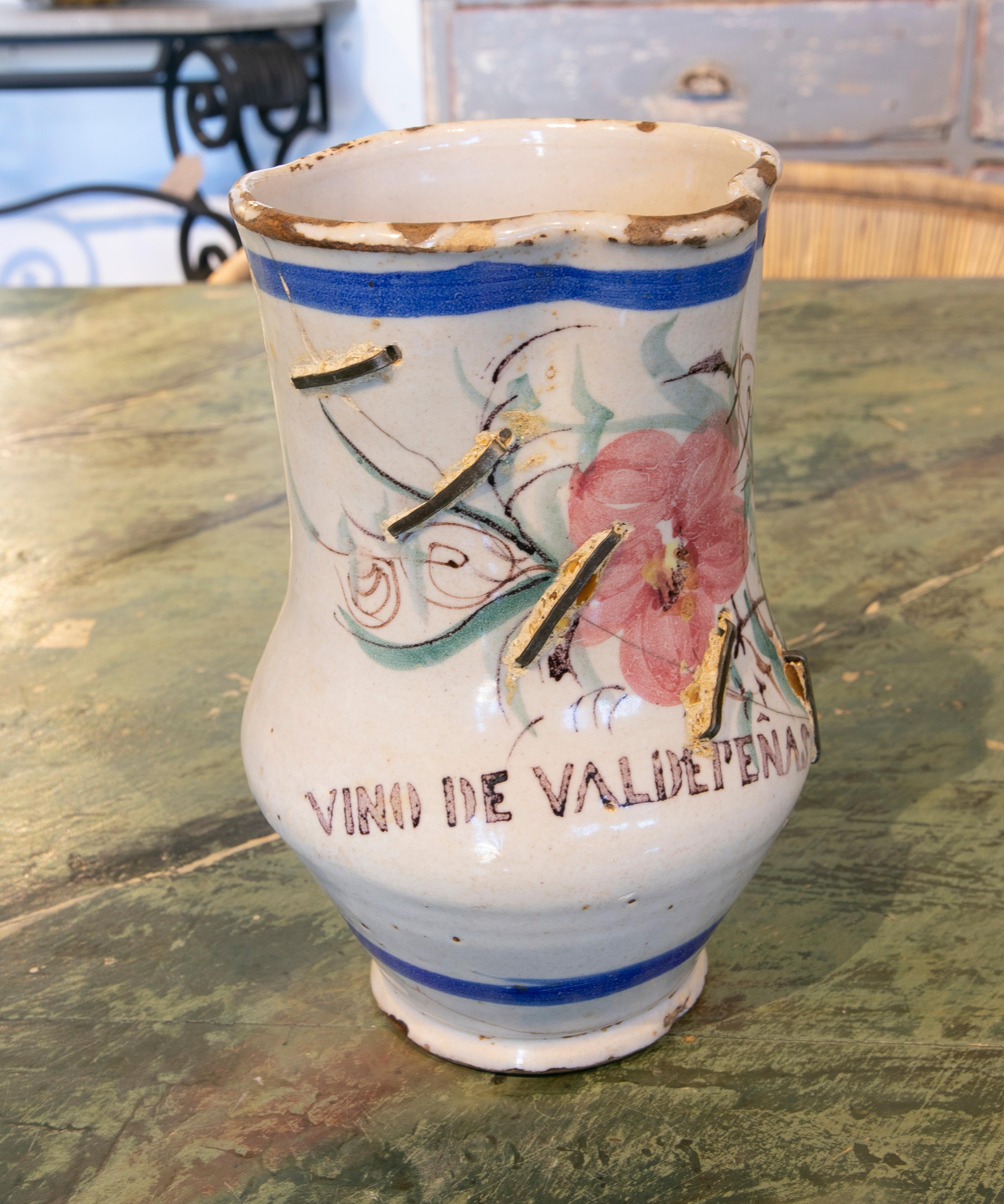 Spanish stained ceramic wine jug with inscription 