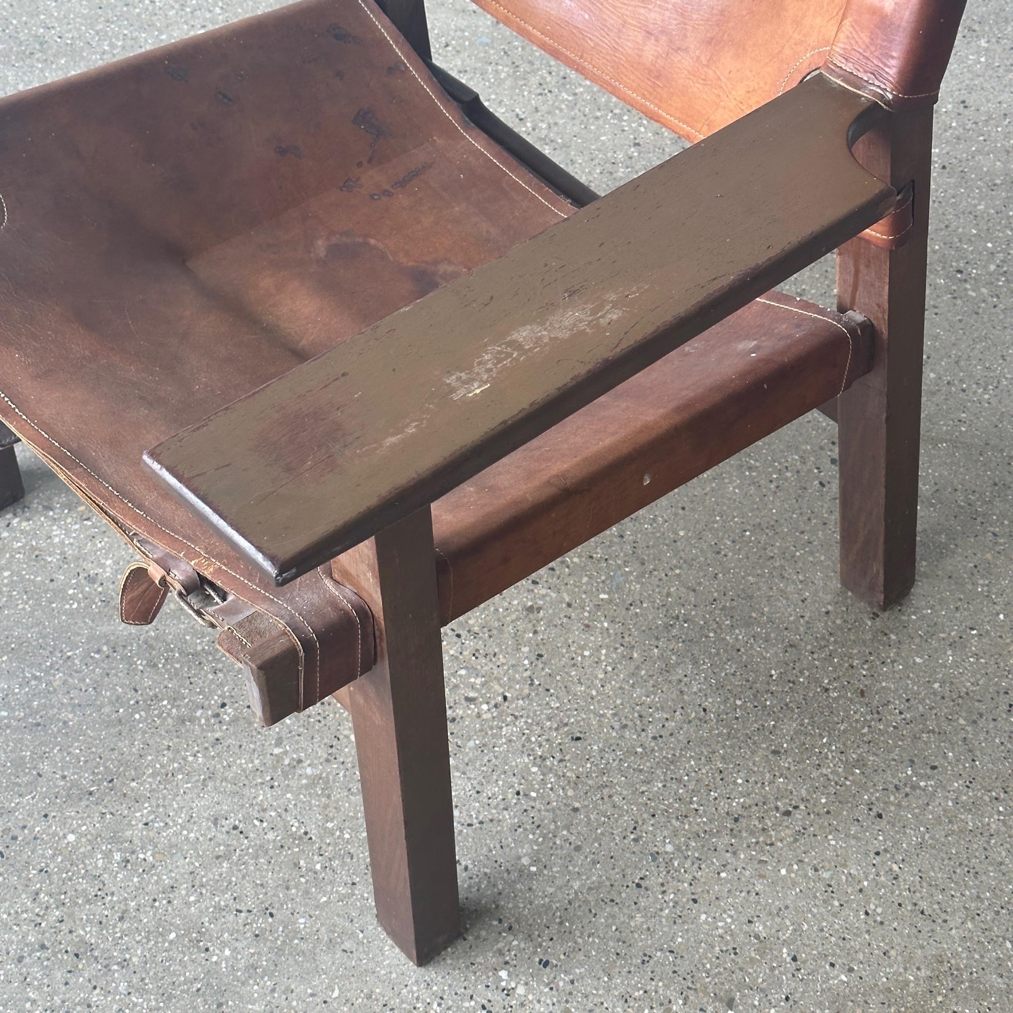 c. 1960s. Made in Denmark. Oak wood frame with leather sling. 

