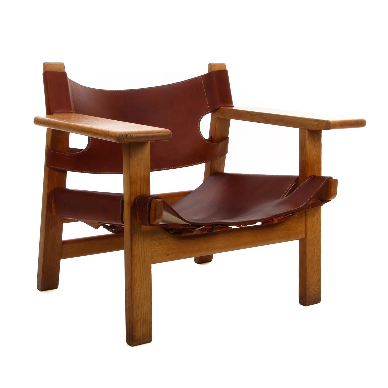 Spanish Chair by Børge Mogensen for Fredericia Furniture in 1958 - vintage edition with oak and original patinated cognac leather upholstery, in good vintage condition.

This is an iconic easy chair with its distinctive profile - solid oak frame