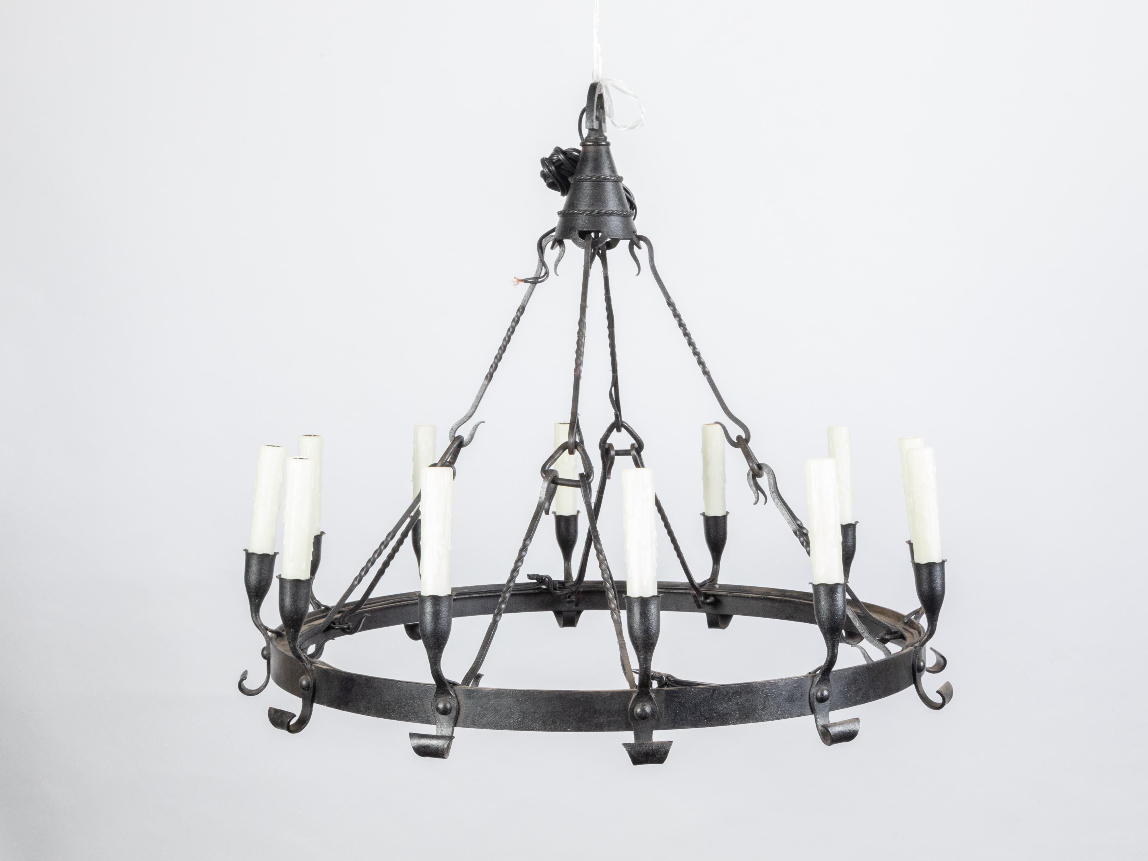 Spanish Colonial 1900s 12-Light Iron Chandelier with Ring and Dark Patina In Good Condition For Sale In Atlanta, GA