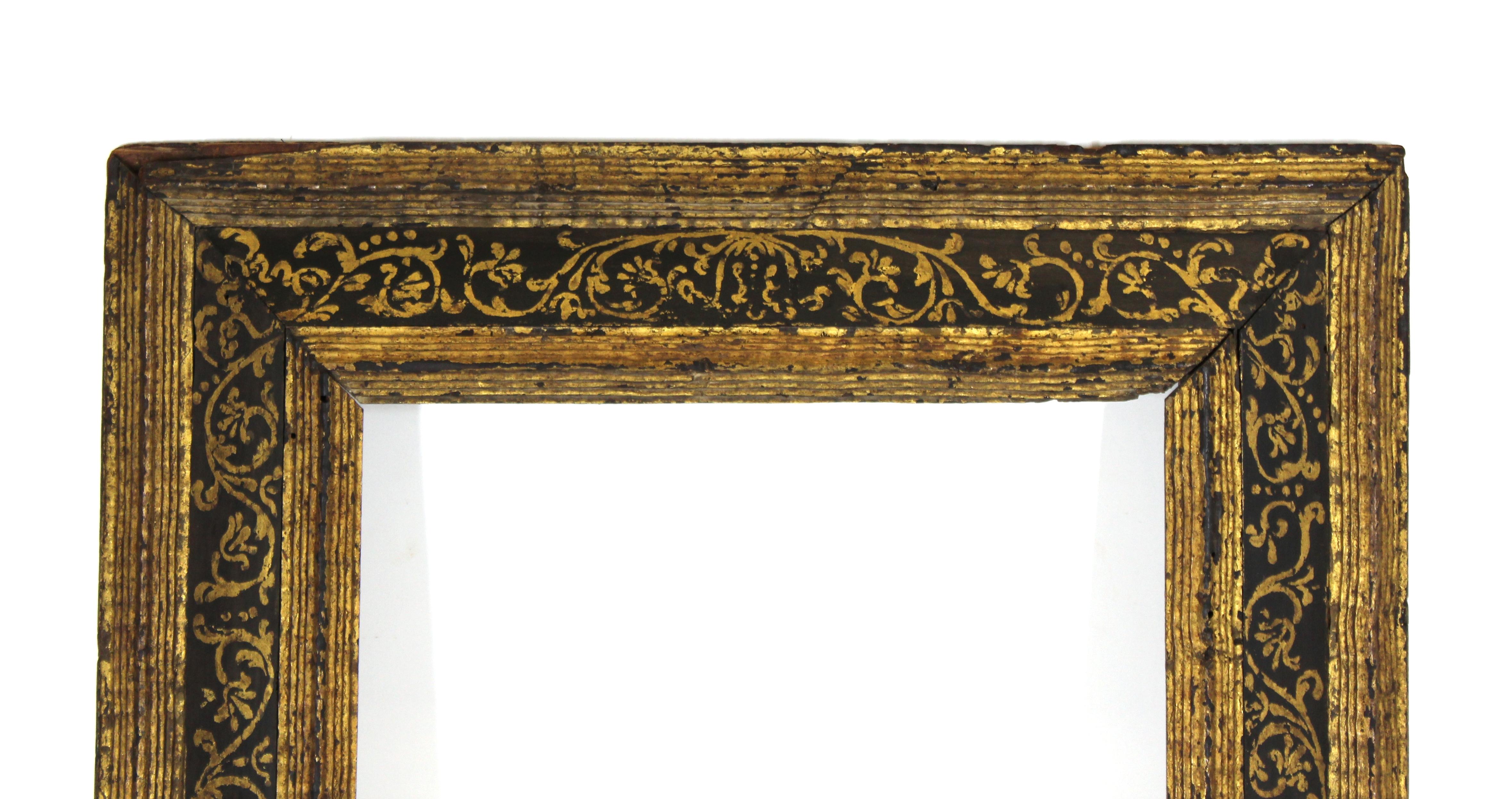Spanish Colonial Baroque giltwood frame with elaborately decorated foliage motif border in raised gold relief paint technique. The piece dates from the late 17th-early 18th century and originates from South America. In remarkable original antique