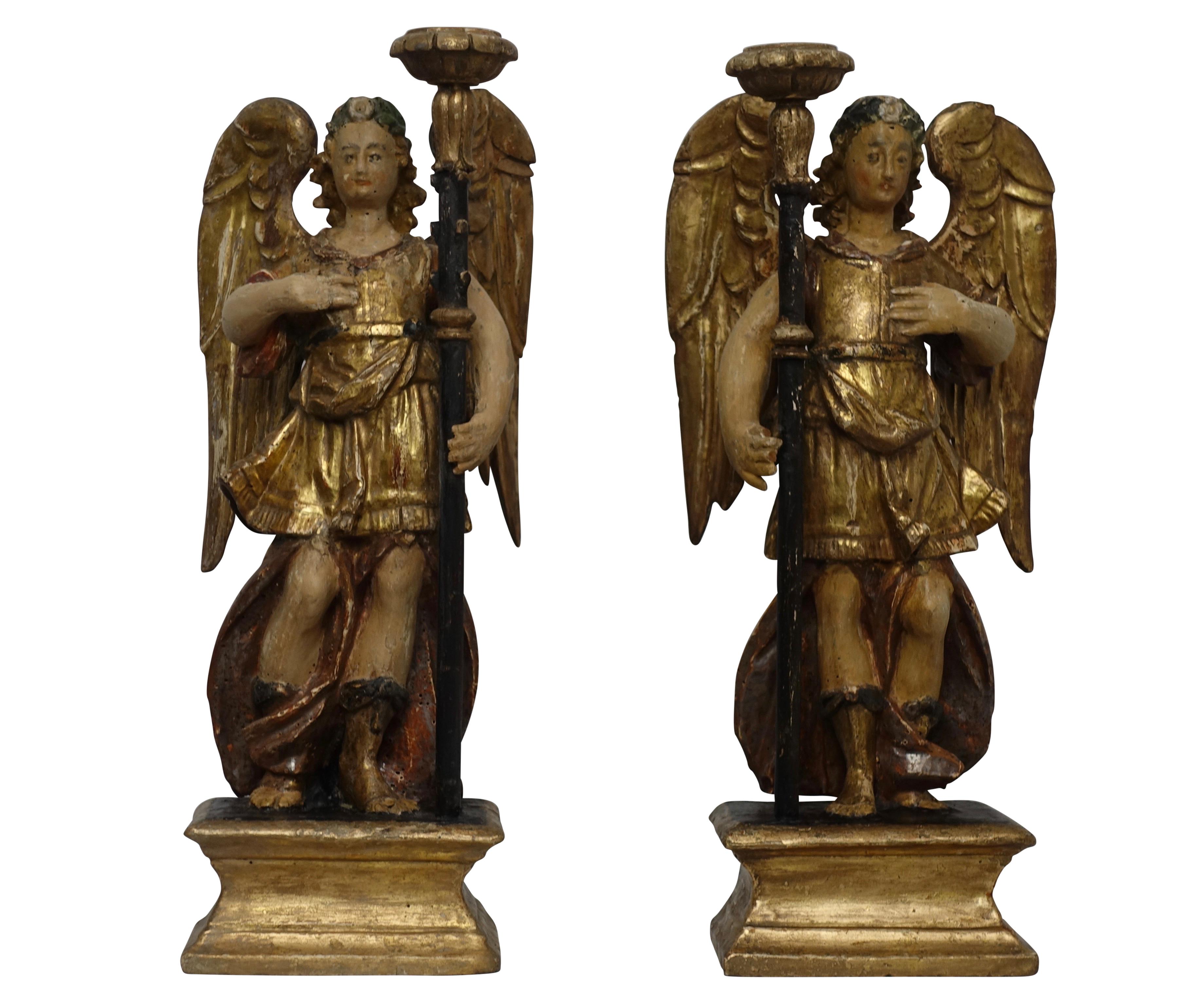 Spanish colonial pair of wonderfully carved, painted and giltwood angel candleholders. Late 18th century.
 