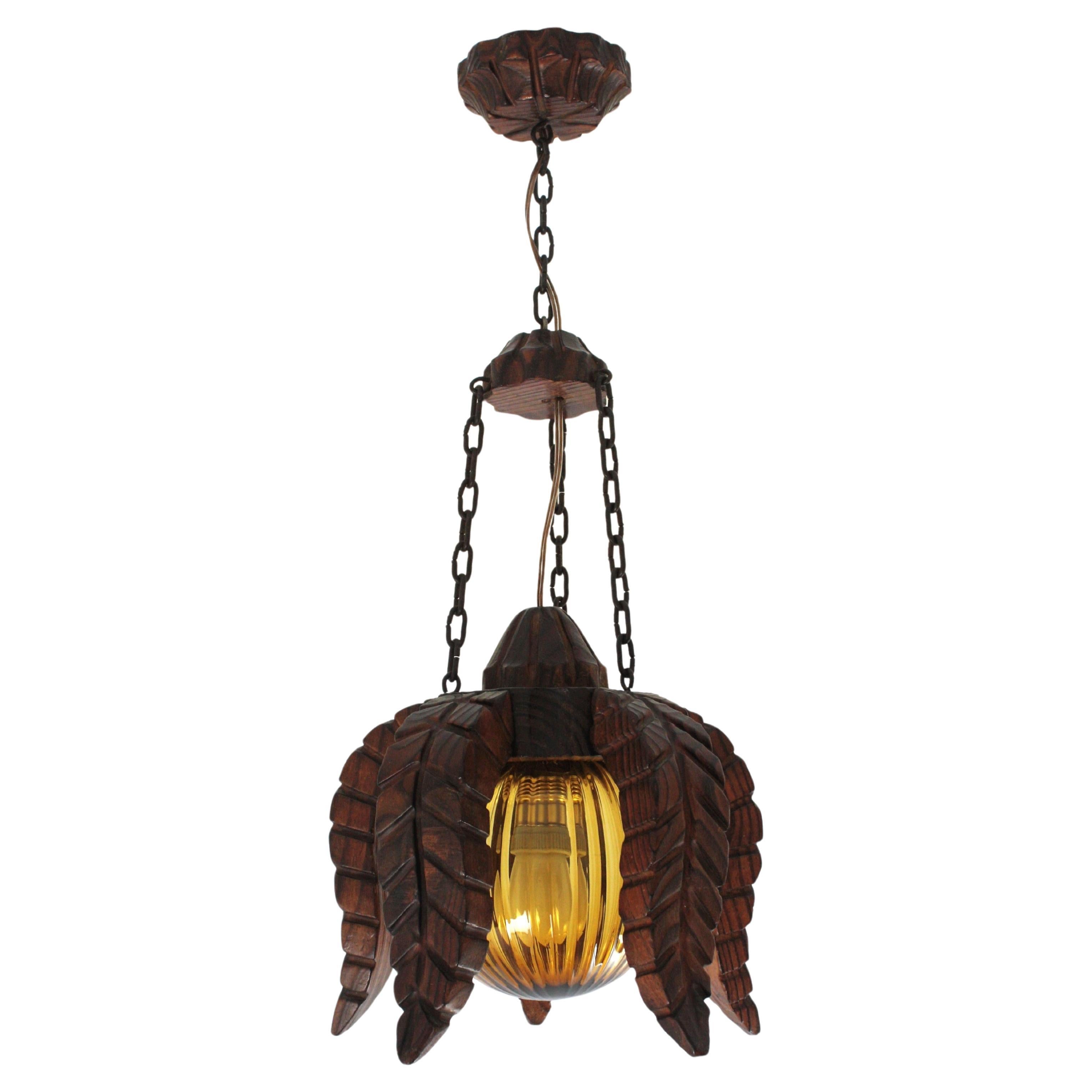 Spanish Colonial Flower Sunburst Pendant Light in Wood & Amber Glass, 1940s