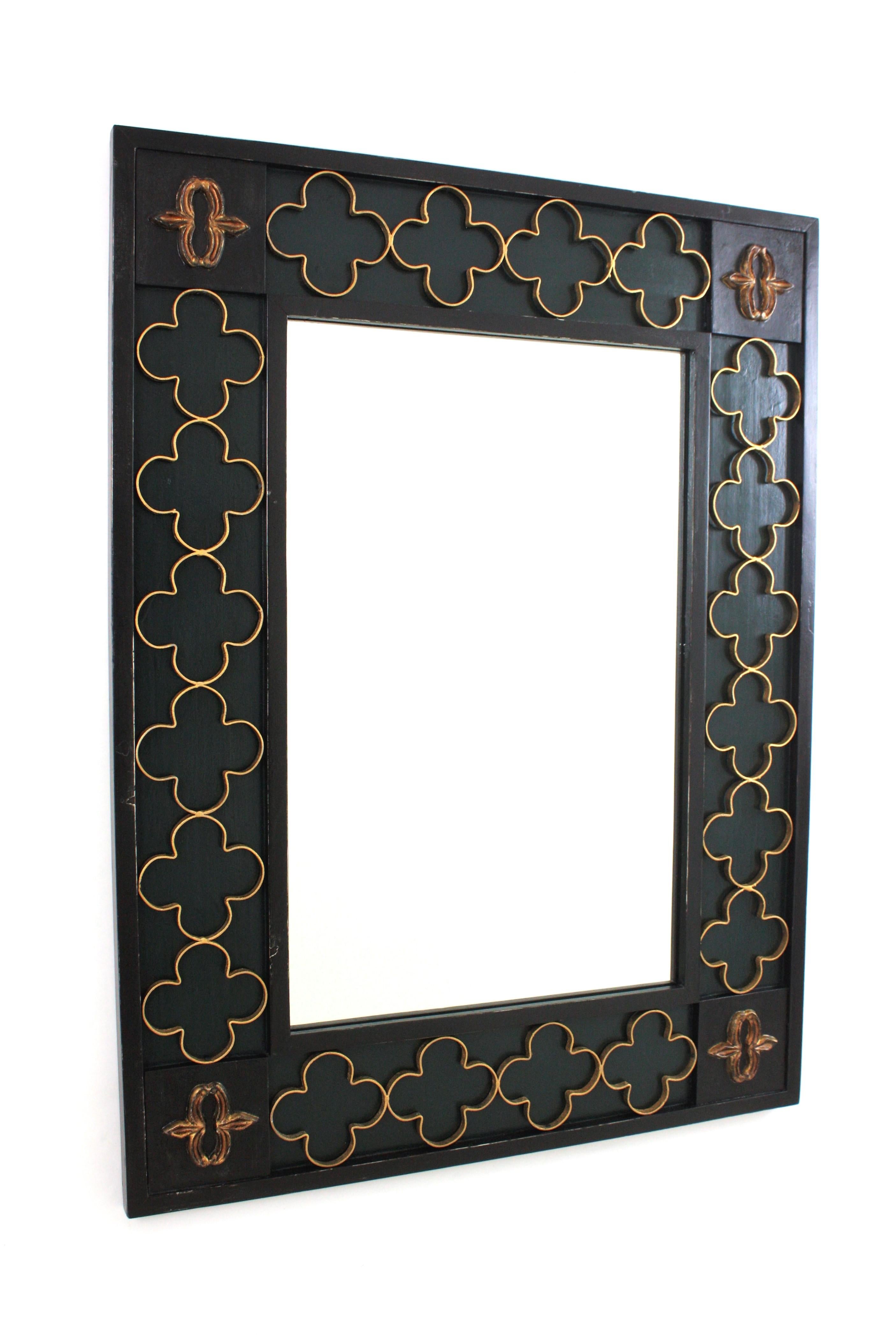 Rectangular Spanish Revival Mirror with Gilt Iron Rosettes, Spain, 1950-1960.
Outstanding rectangular black painted frame with carving details on the corners. It has an inset frame with a dark green painted background and a decorative attached