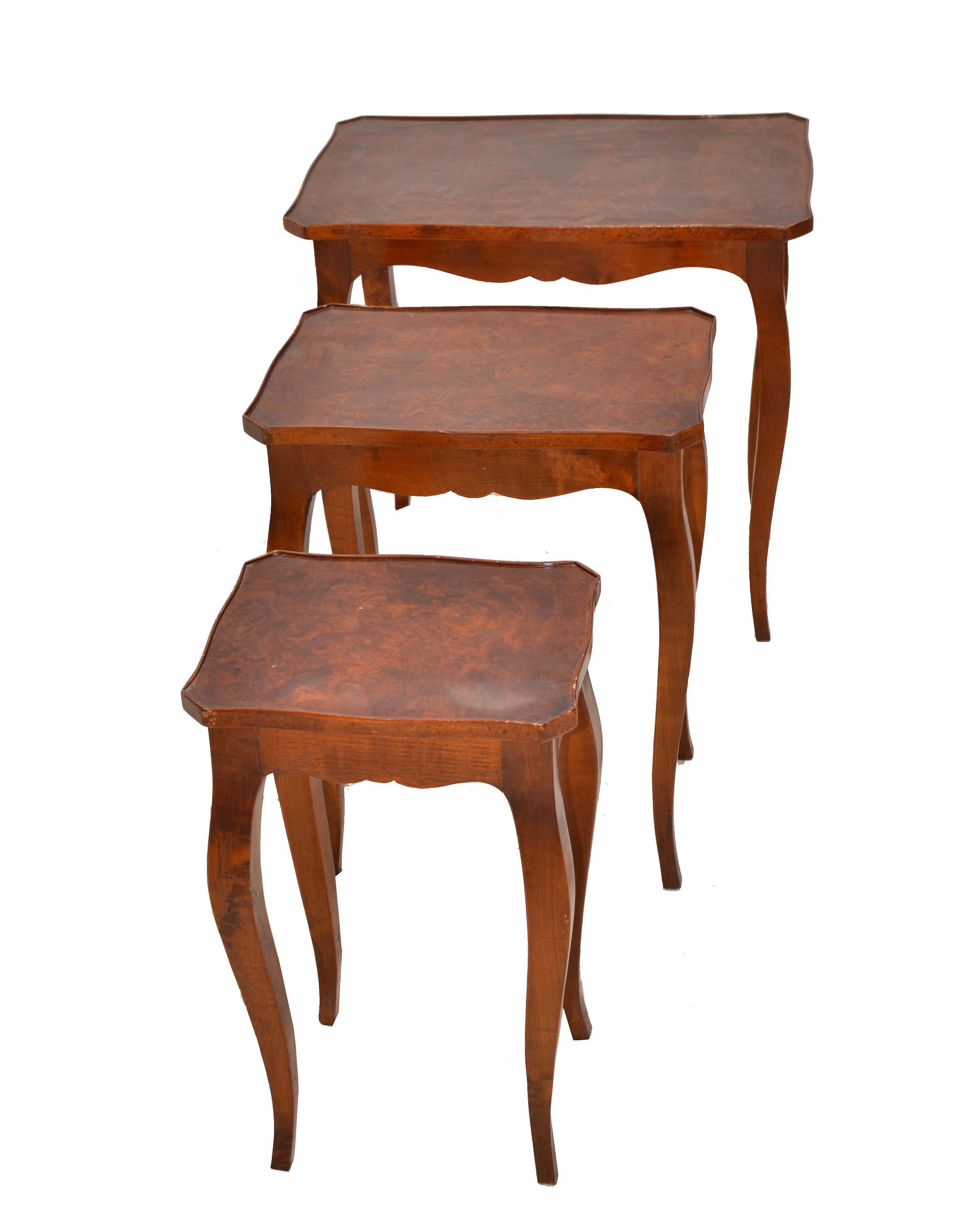 Set of 3 Spanish Colonial Empire style nesting tables or stacking tables in olive wood and hand carved curved legs. 

Size of each table:
15.63 D x 20 L x 23.63 inches H.
12.5 D x 17.38 L x 21.5 inches H.
10 D x 12.25 L x 20 inches H.
