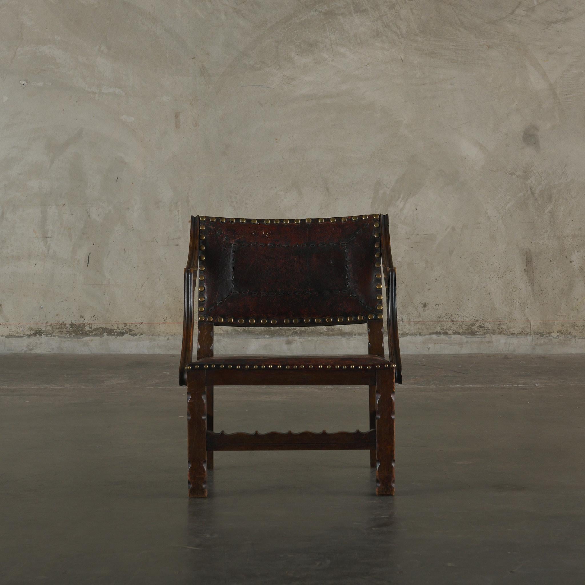 Unknown Spanish Colonial Leather Studded Low Arm Chair For Sale