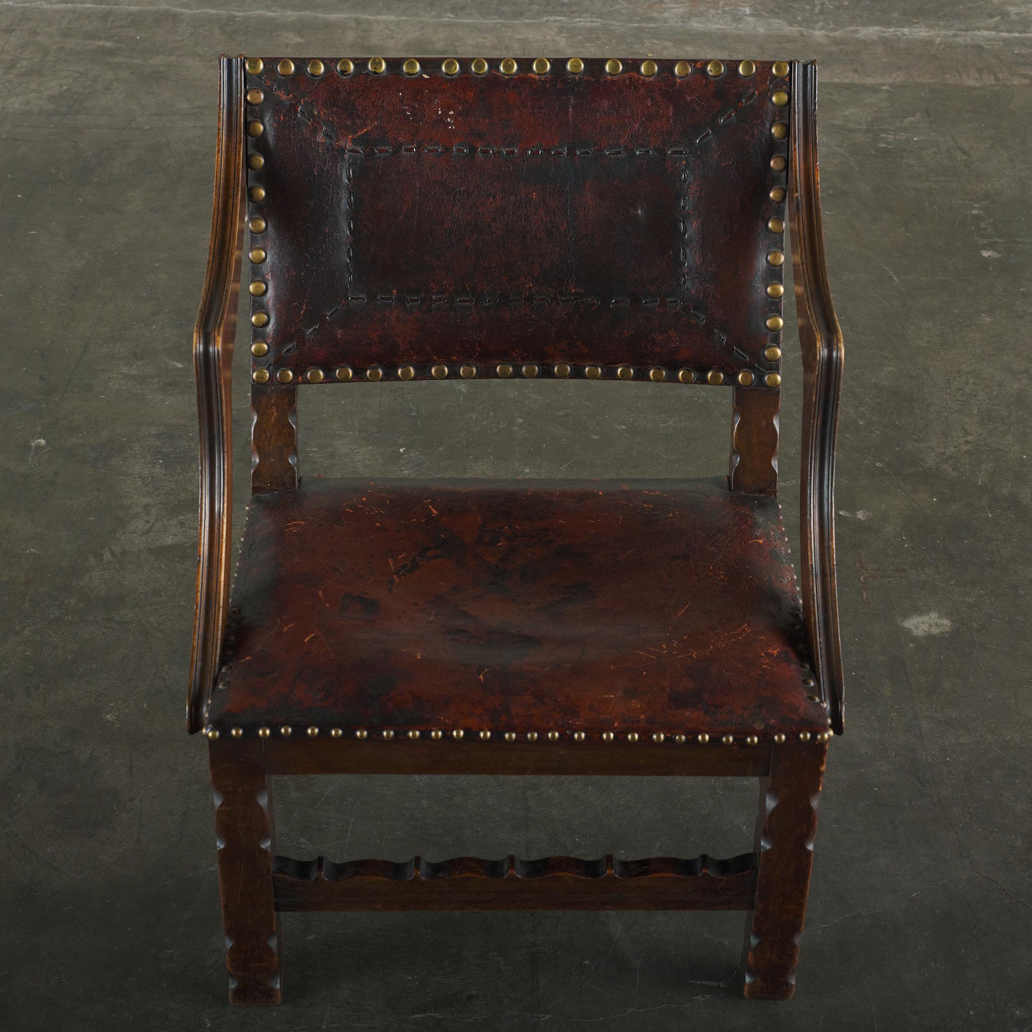 Spanish Colonial Leather Studded Low Arm Chair In Good Condition For Sale In Los Angeles, CA