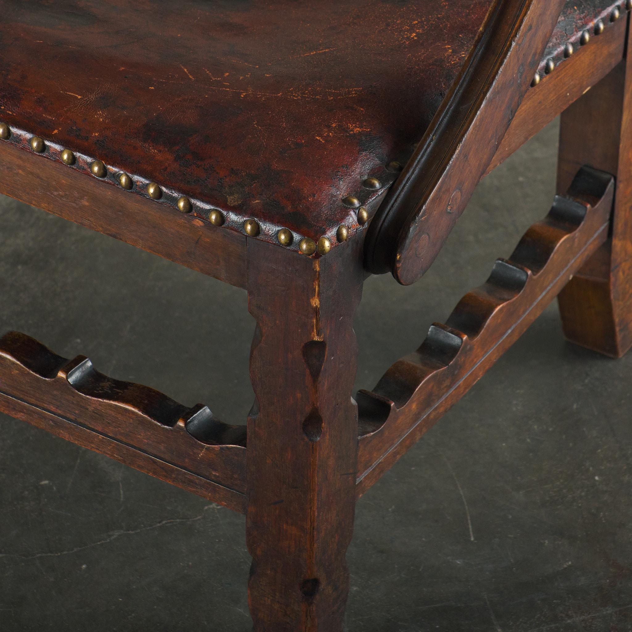 20th Century Spanish Colonial Leather Studded Low Arm Chair For Sale
