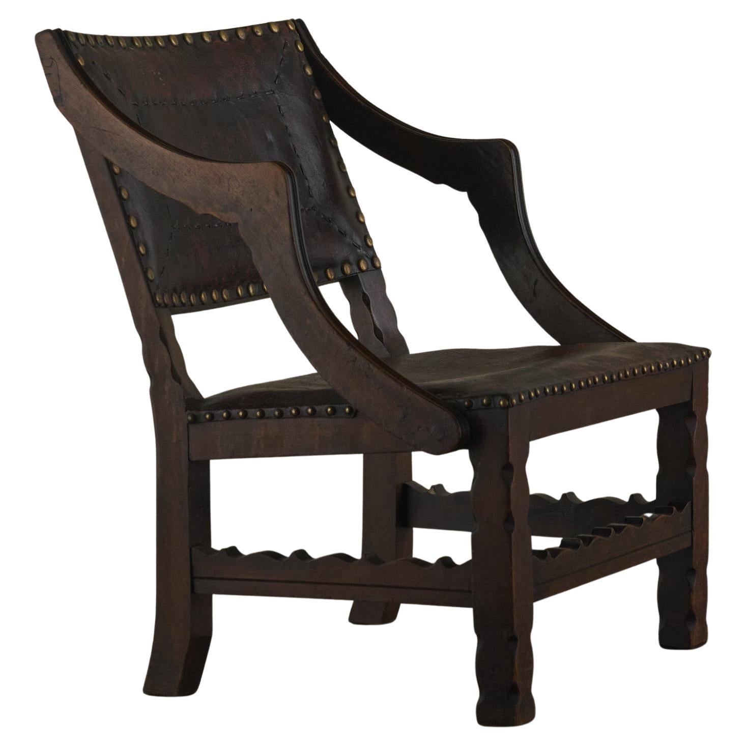 Spanish Colonial Leather Studded Low Arm Chair For Sale