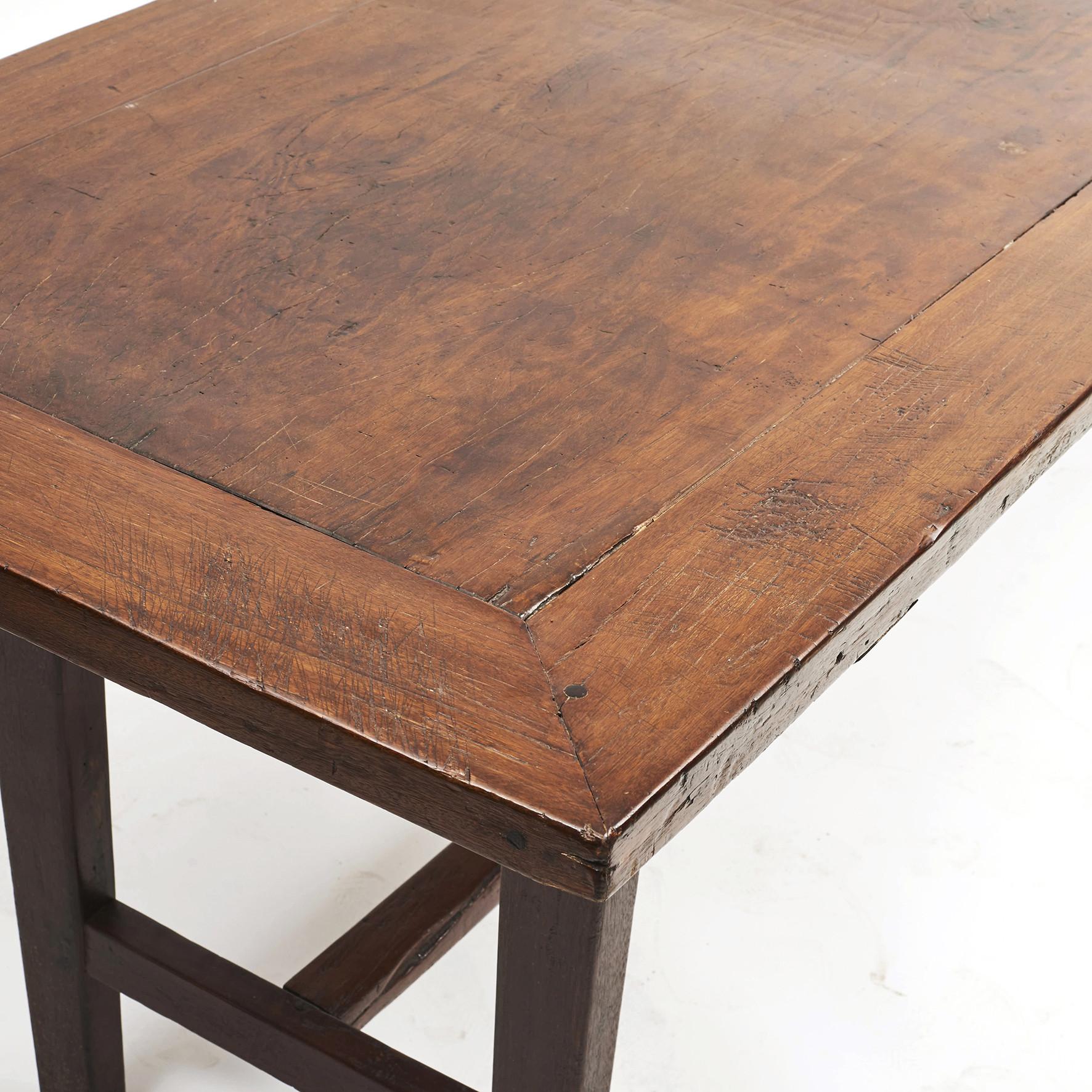 Long tables from the Philippines, circa 1860-1880. Legs and frame made of Balayong wood, center top plate in one piece of Molava wood. Both types of wood are tropical hardwood and very beautiful. Rraised on legs joined by an H-form stretcher.
The