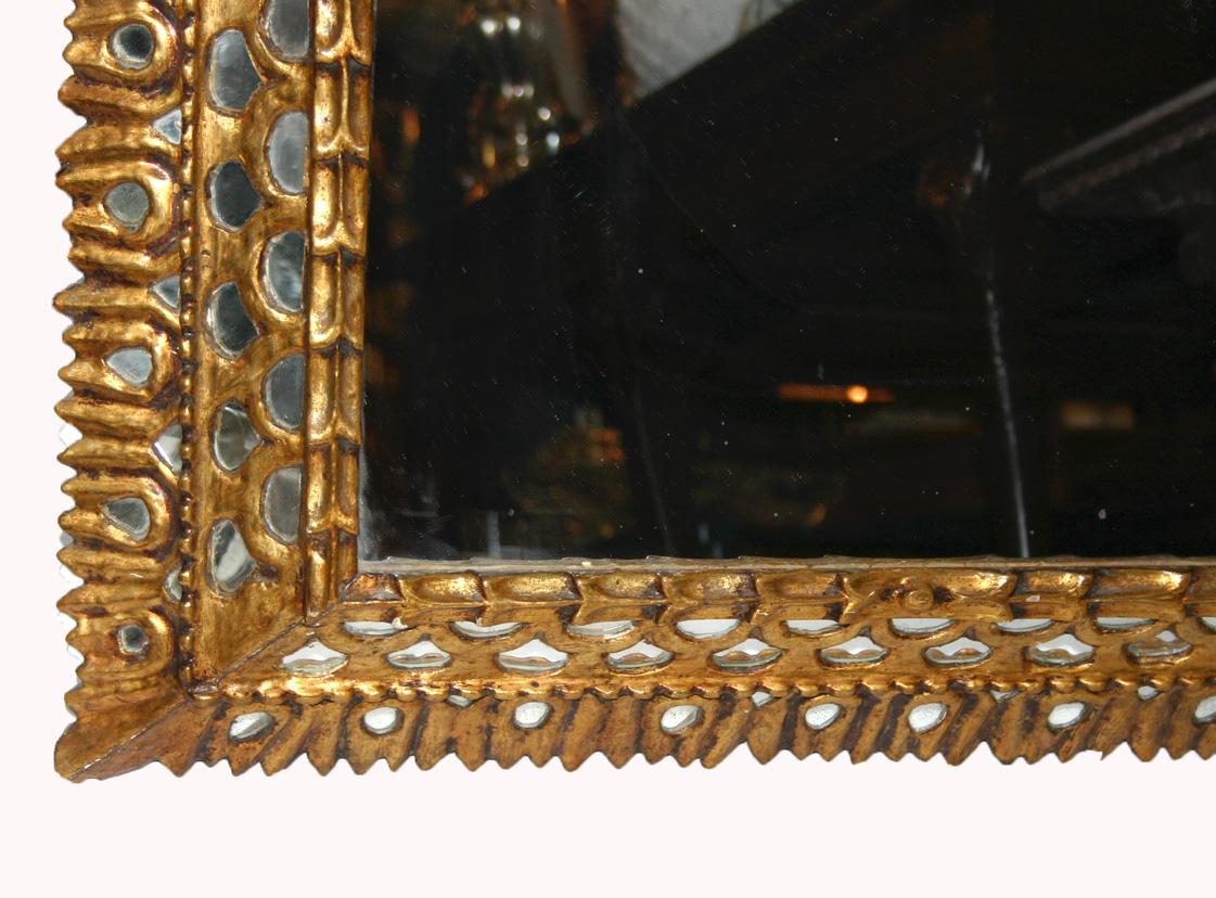 Late 19th Century Spanish Colonial gilt wood mirror with mirror insets.

Measurements:
Depth: 4