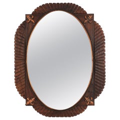 Miroir ovale colonial espagnol sculpté en bois et cuivre aux accents de fleur de lys