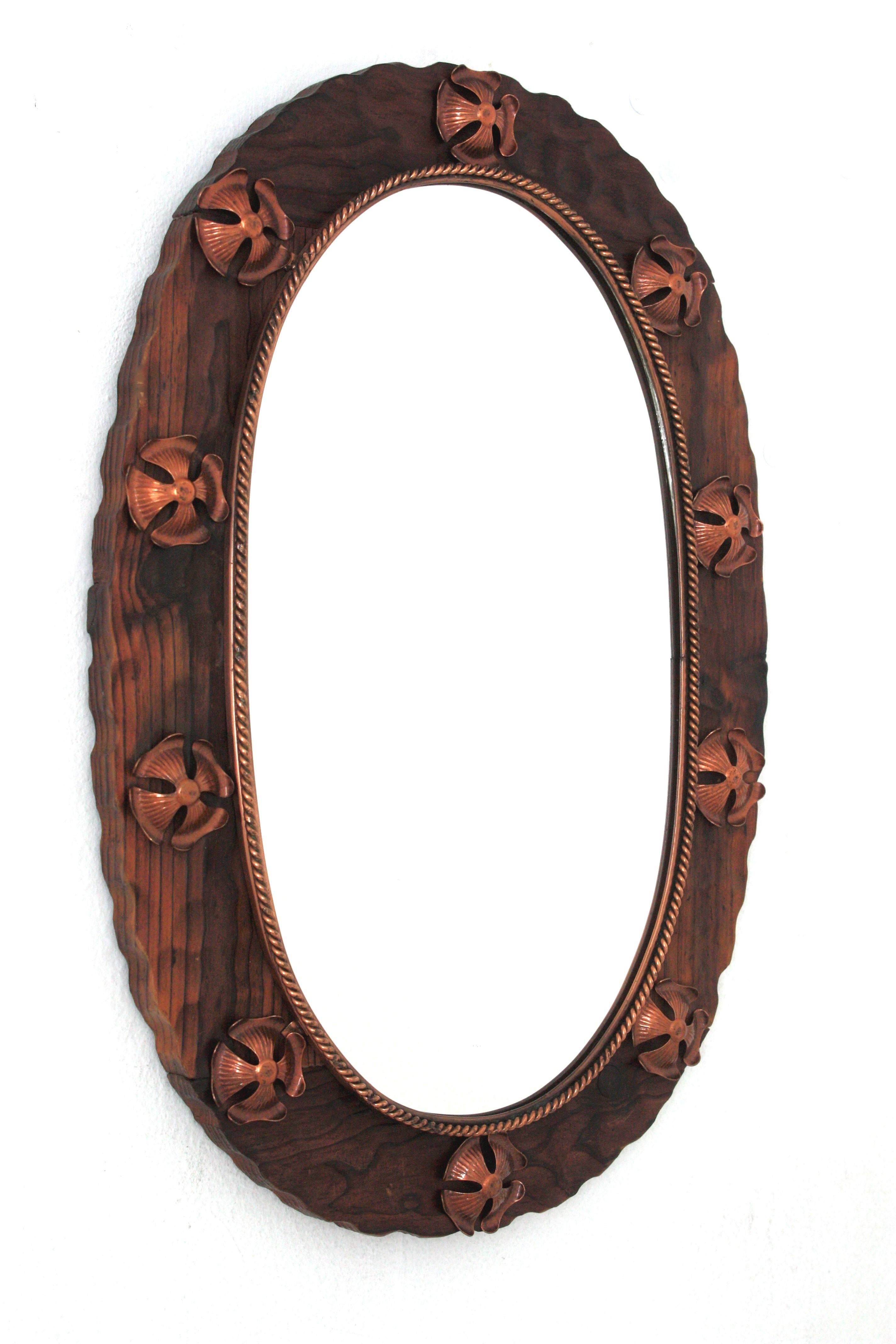 Hand-Carved Spanish Colonial Oval Mirror in Carved Wood with Copper Metal Flowers For Sale