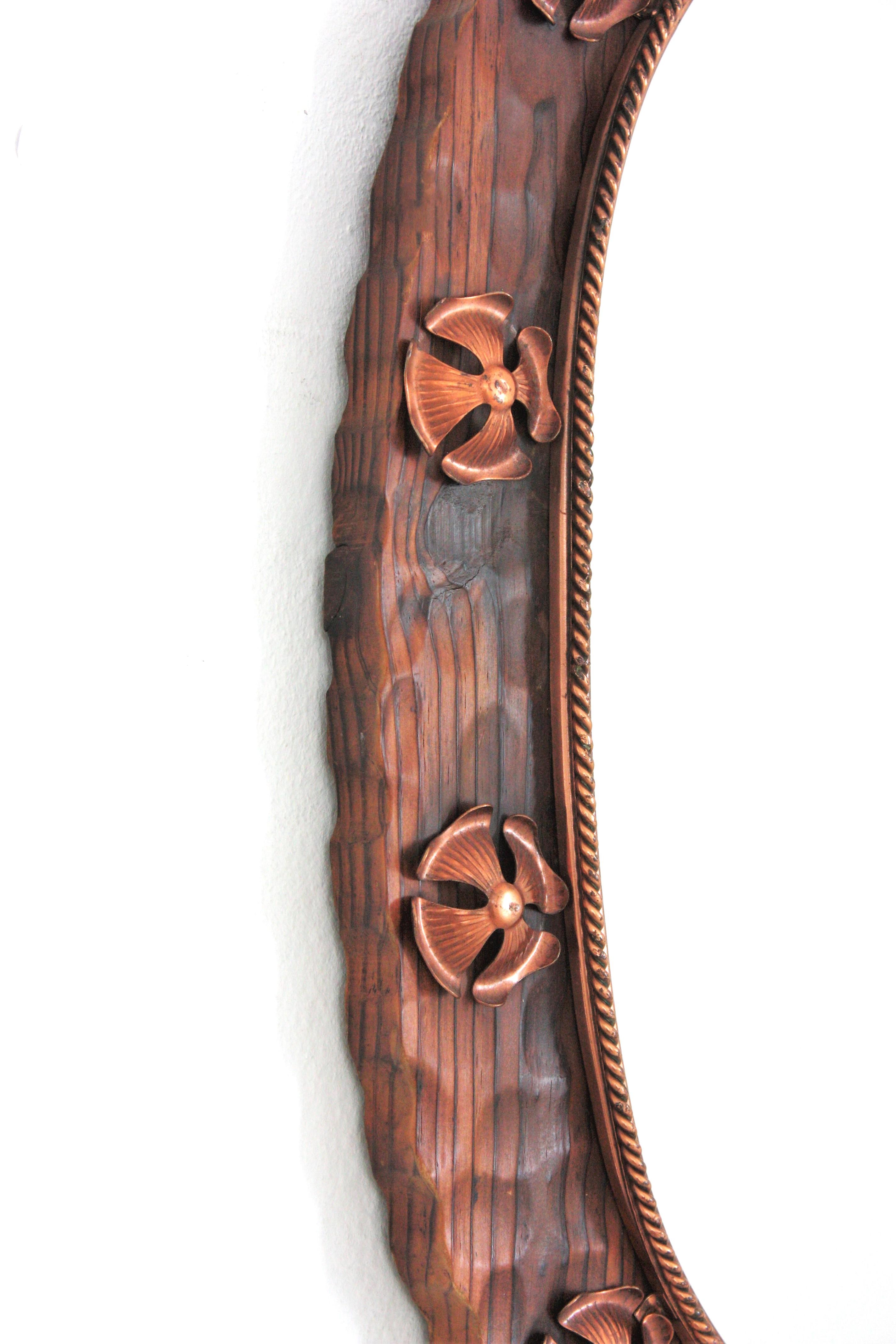 20th Century Spanish Colonial Oval Mirror in Carved Wood with Copper Metal Flowers For Sale