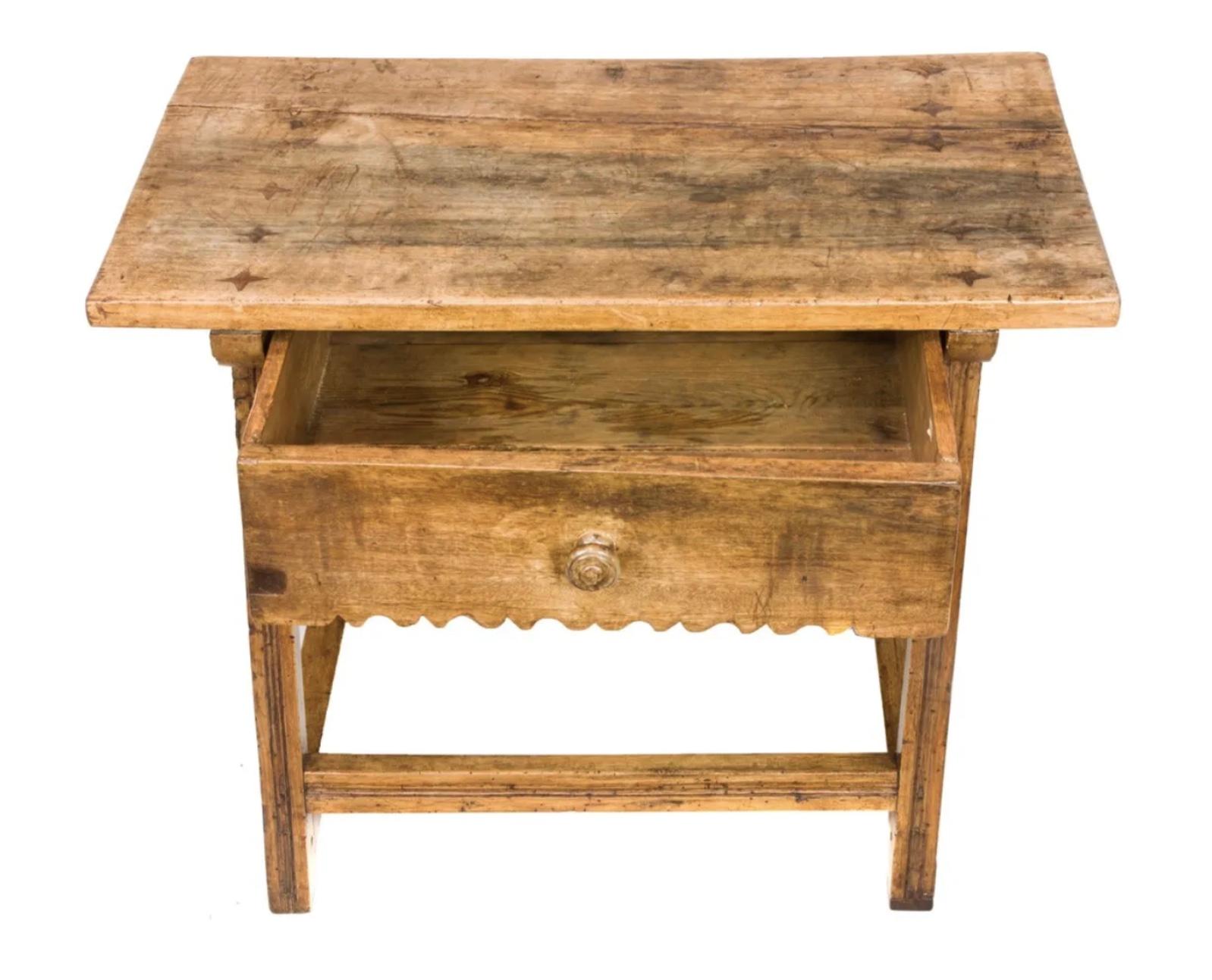 A superb Spanish Colonial one-drawer hacienda table, 18th century. Having a rectangular top, inlaid with stars above a single suspended drawer supported by trestle-form legs. The legs joined by a simple stretcher. Wonderful old wear and patina.
