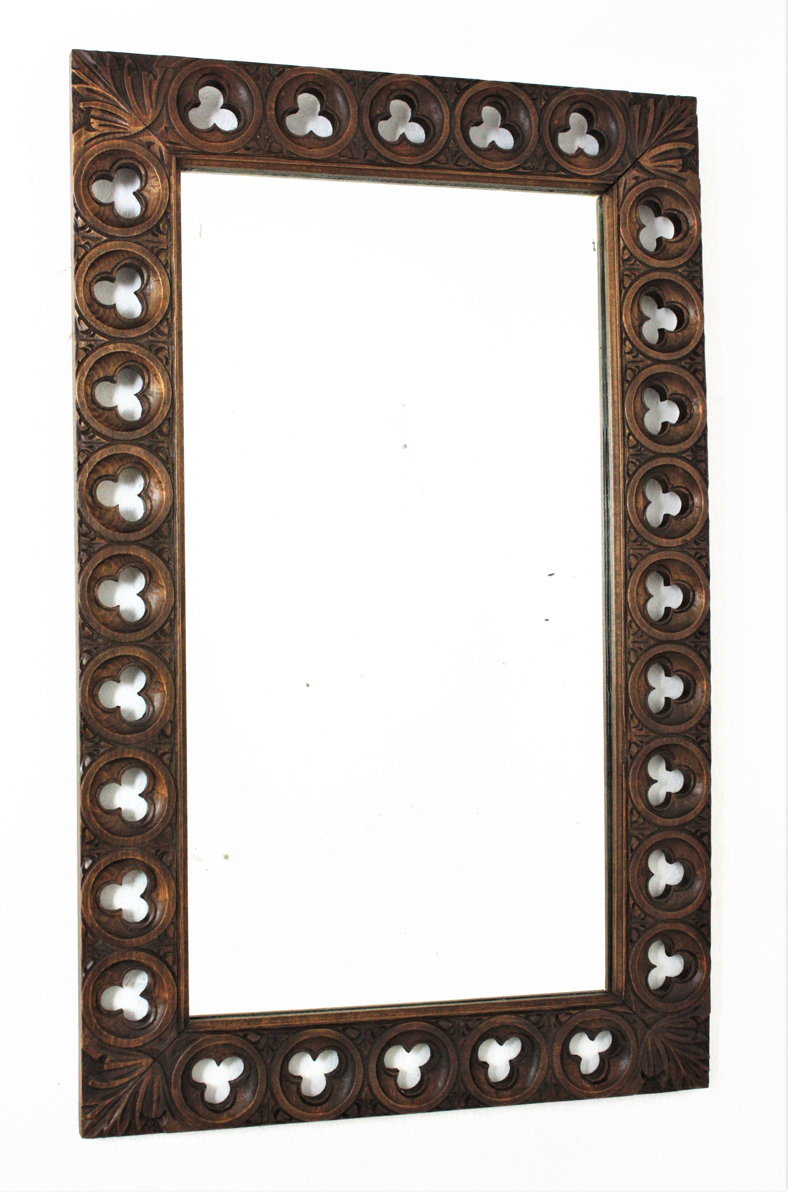 Hand carved Spanish Colonial Romanesque inspired wall mirror, Spain, 1940s.
Beautiful frame with carving details with Romanesque accents. The frame is beautifully adorned by foliage and lobular floral carvings.
It will be a nice a addition to a