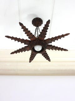 Spanish Colonial Starburst Pendant Light Fixture in Carved Wood, 1940s