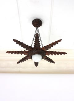 Spanish Colonial Starburst Pendant Light Fixture in Carved Wood, 1940s