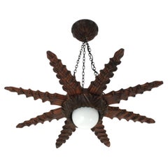 Spanish Colonial Starburst Pendant Light Fixture in Carved Wood, 1940s