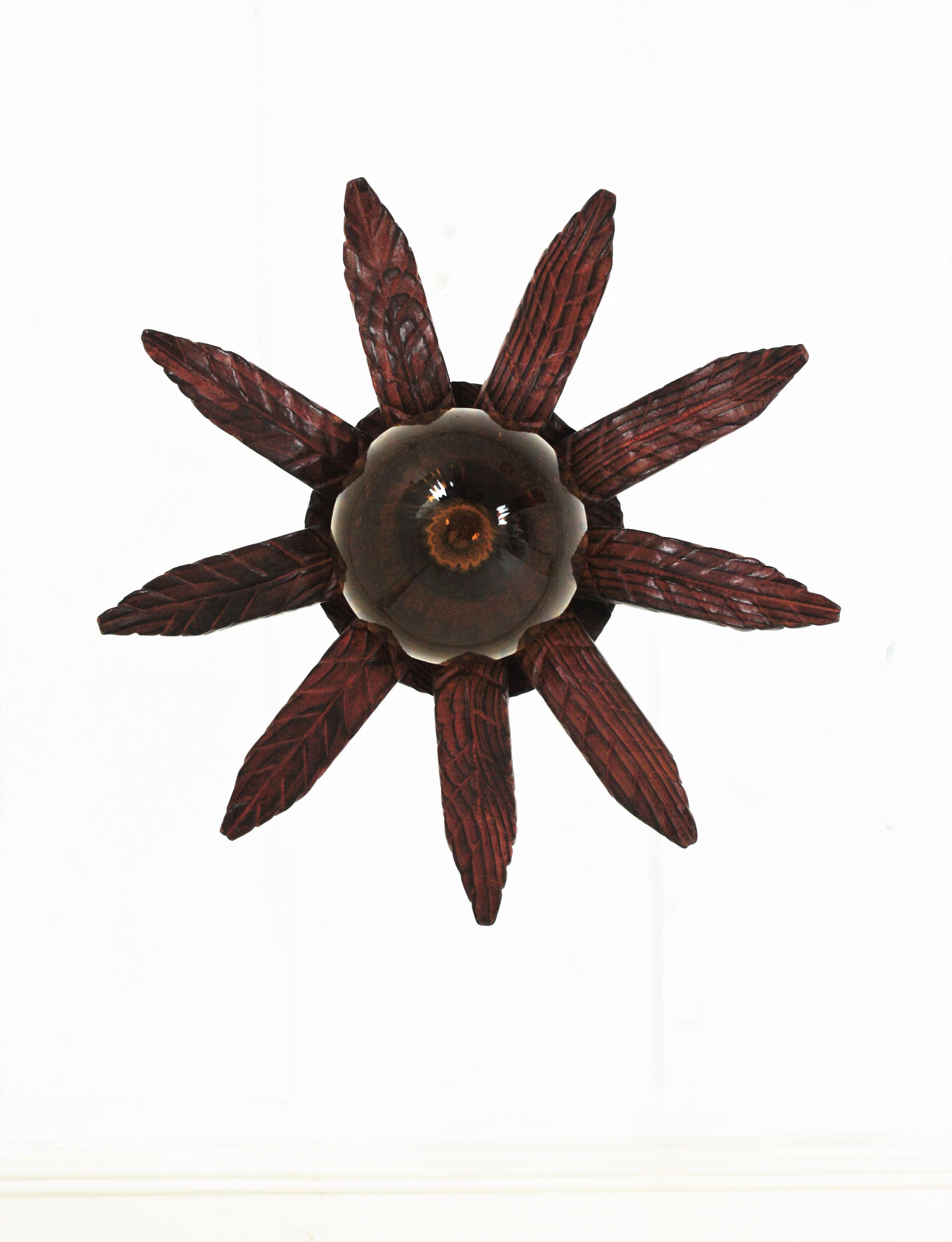 Spanish Colonial Sunburst Light Fixture in Carved Wood with Amber Glass Globe For Sale 8