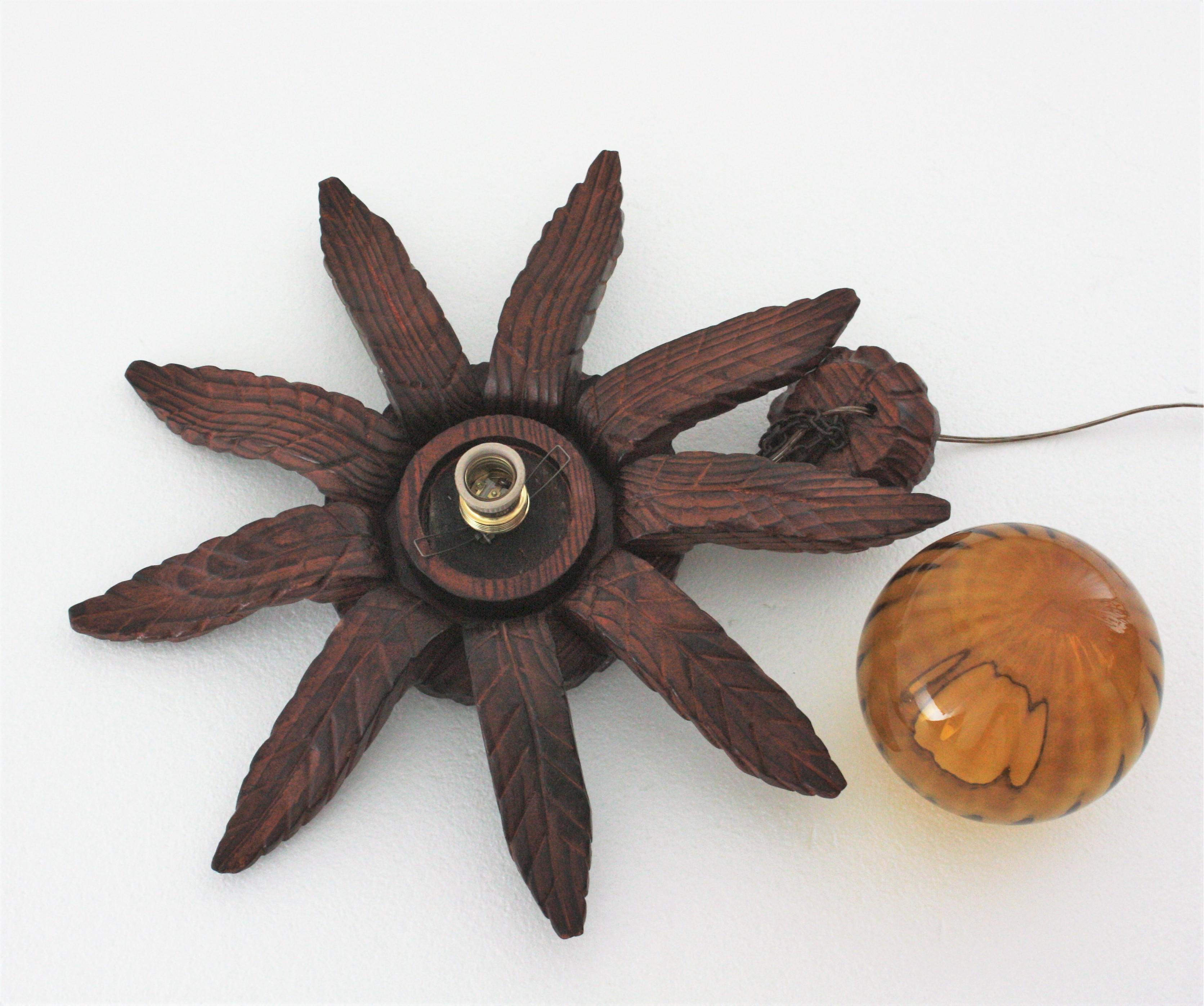 Spanish Colonial Sunburst Light Fixture in Carved Wood with Amber Glass Globe For Sale 14