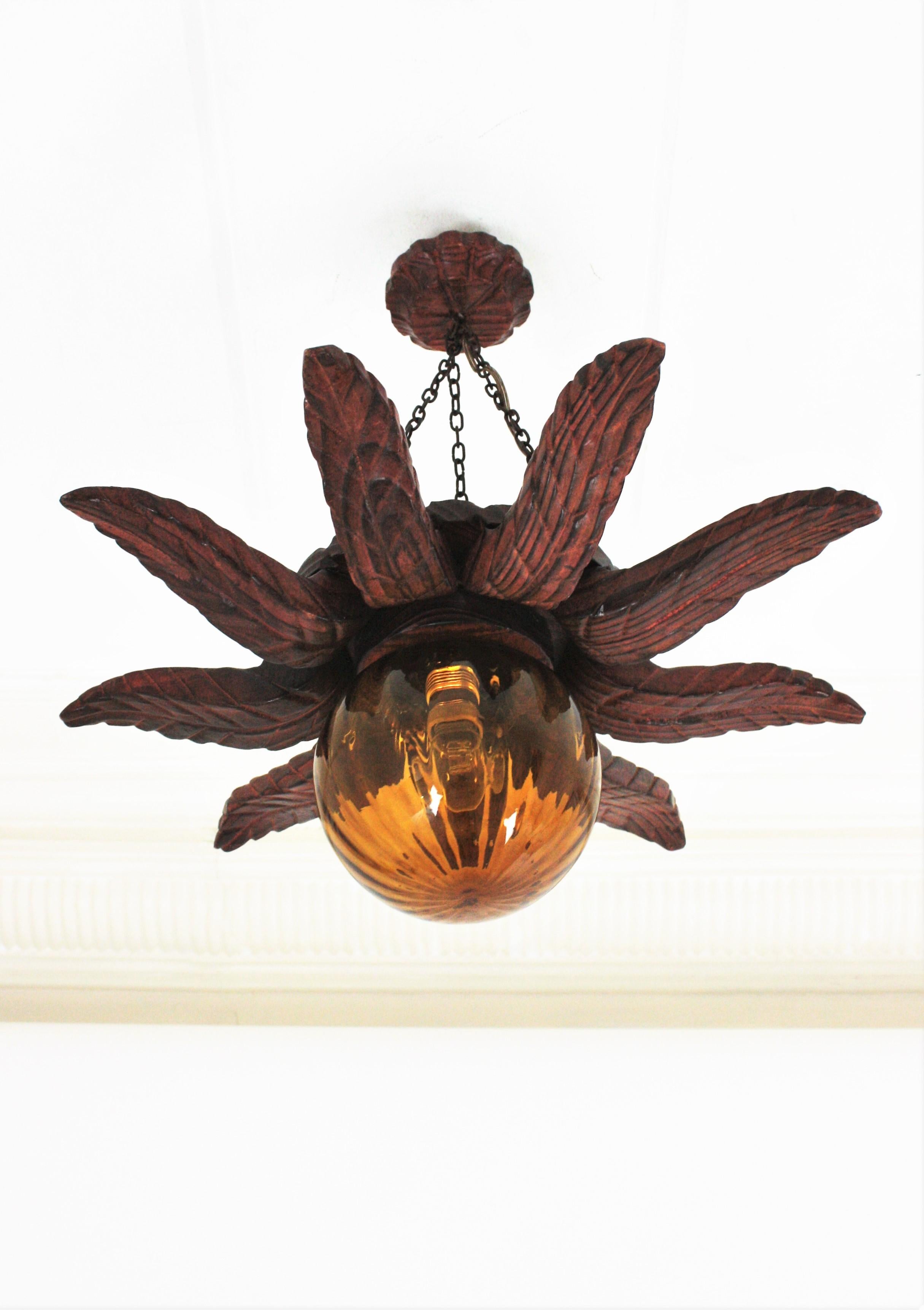 Spanish Colonial Sunburst Light Fixture in Carved Wood with Amber Glass Globe For Sale 15