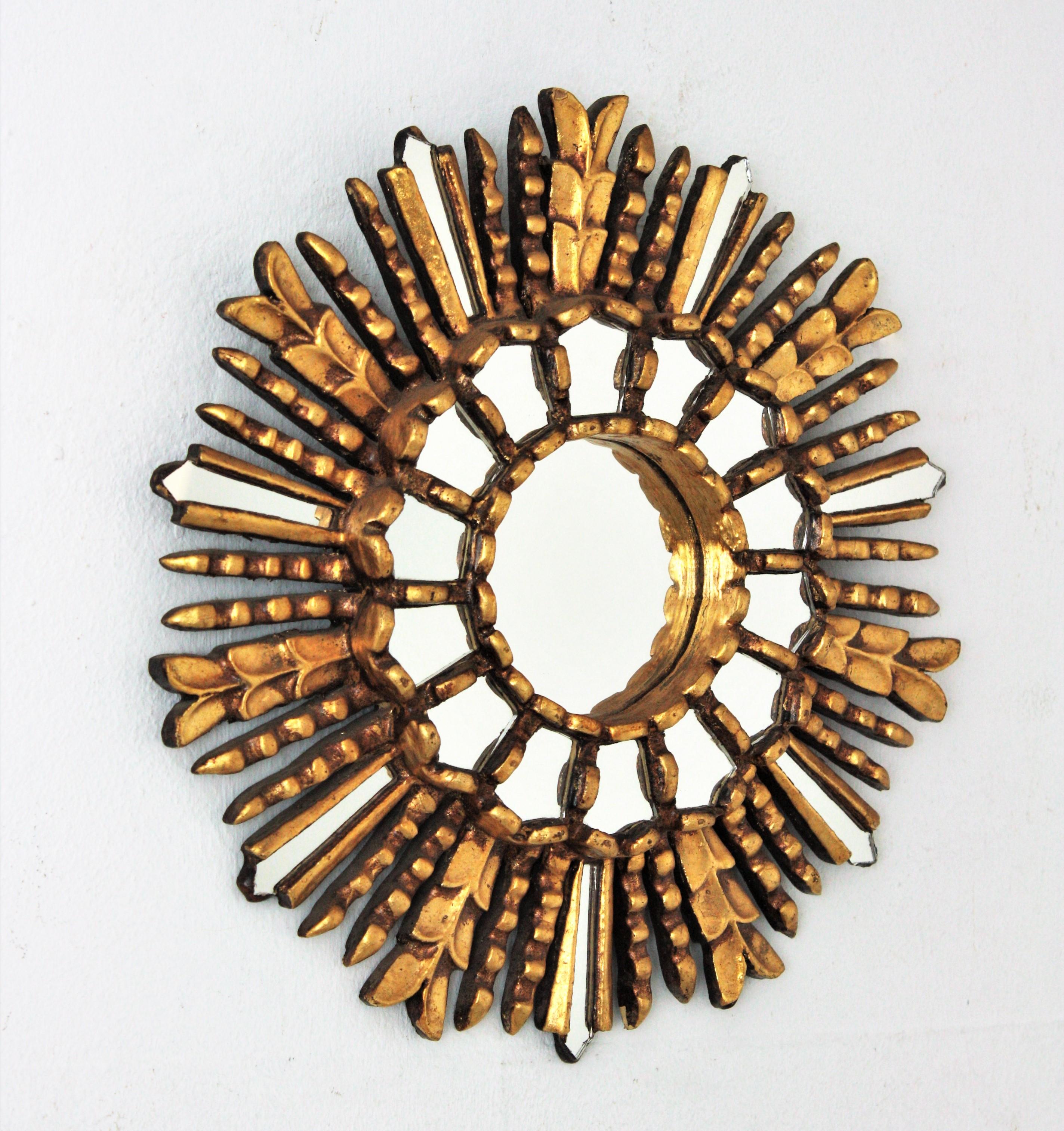 Spanish Colonial Sunburst Mirror in Giltwood with Mirror Insets, 1950s For Sale