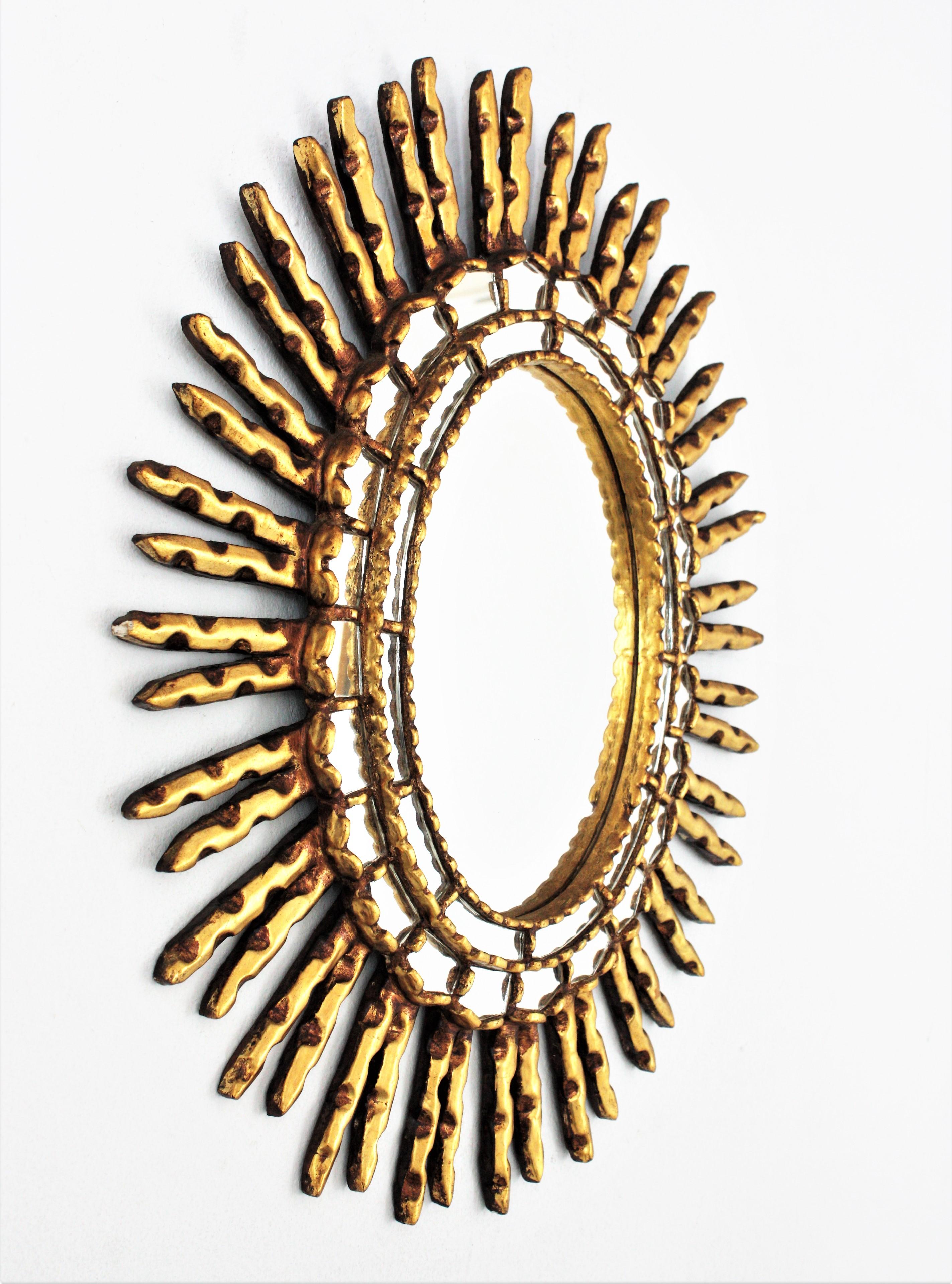 20th Century Spanish Colonial Sunburst Oval Mirror in Giltwood For Sale