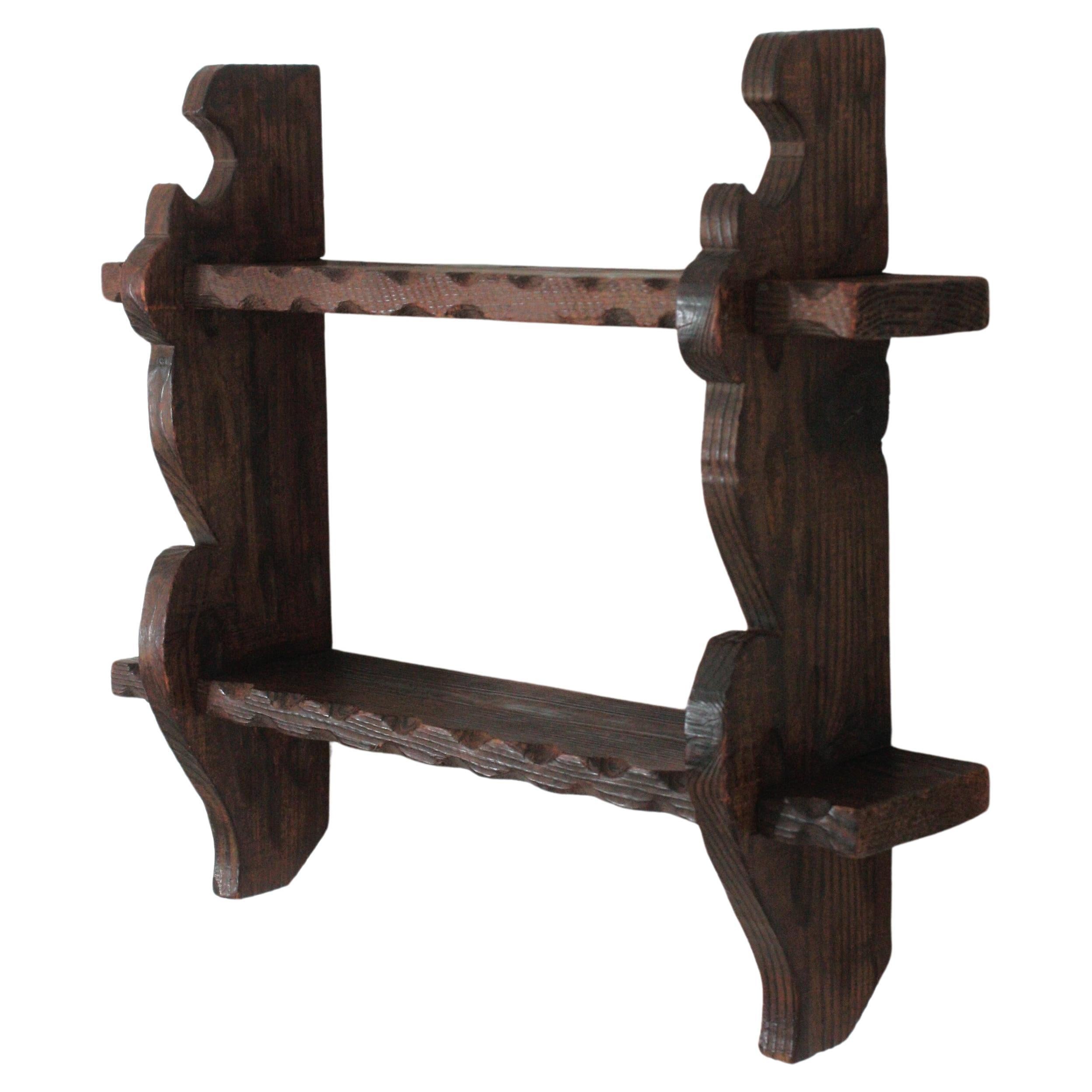 Spanish Colonial Wood Two Tier Spice Rack Wall Shelf, 1940s
Hand-carved pine spice rack or small wall shelf, Spain, 1940s-1950s
This spice rack shelf has scalloped and carved details and decorative iron nails
it has a rustic finish and Spanish