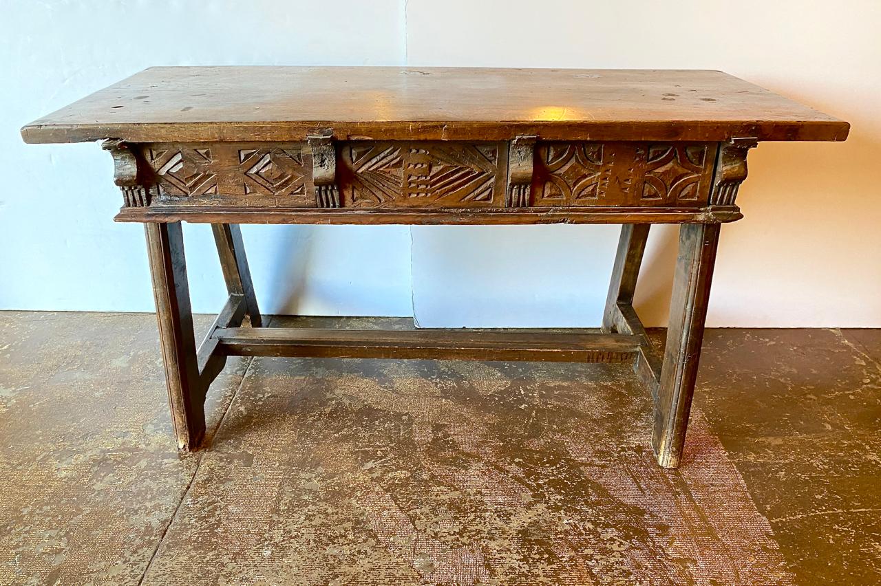 This is a superb example of a late 18th century or early 19th century Spanish Colonial, most probably Mexican, three-drawer writing desk. The mesquite (perhaps sabino) wood structure is solid, with no apparent restorations. The 24-inch single board
