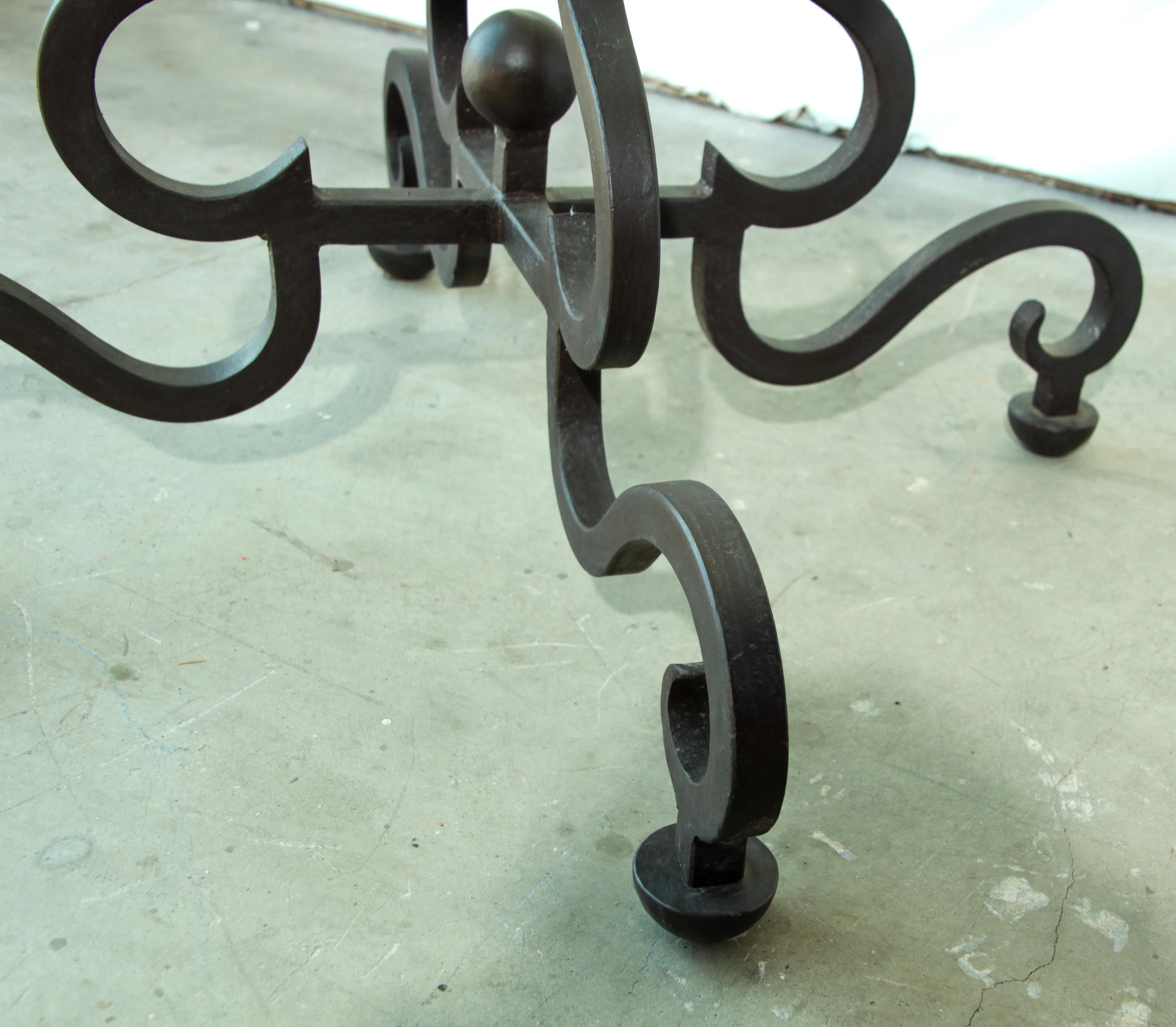 Impressive Spanish round dining table wrought iron base featuring decorative scrolled legs and feet. Heavy iron base with a patinated iron rust finish.
Great for any Spanish Moorish Mediterranean style garden.
  