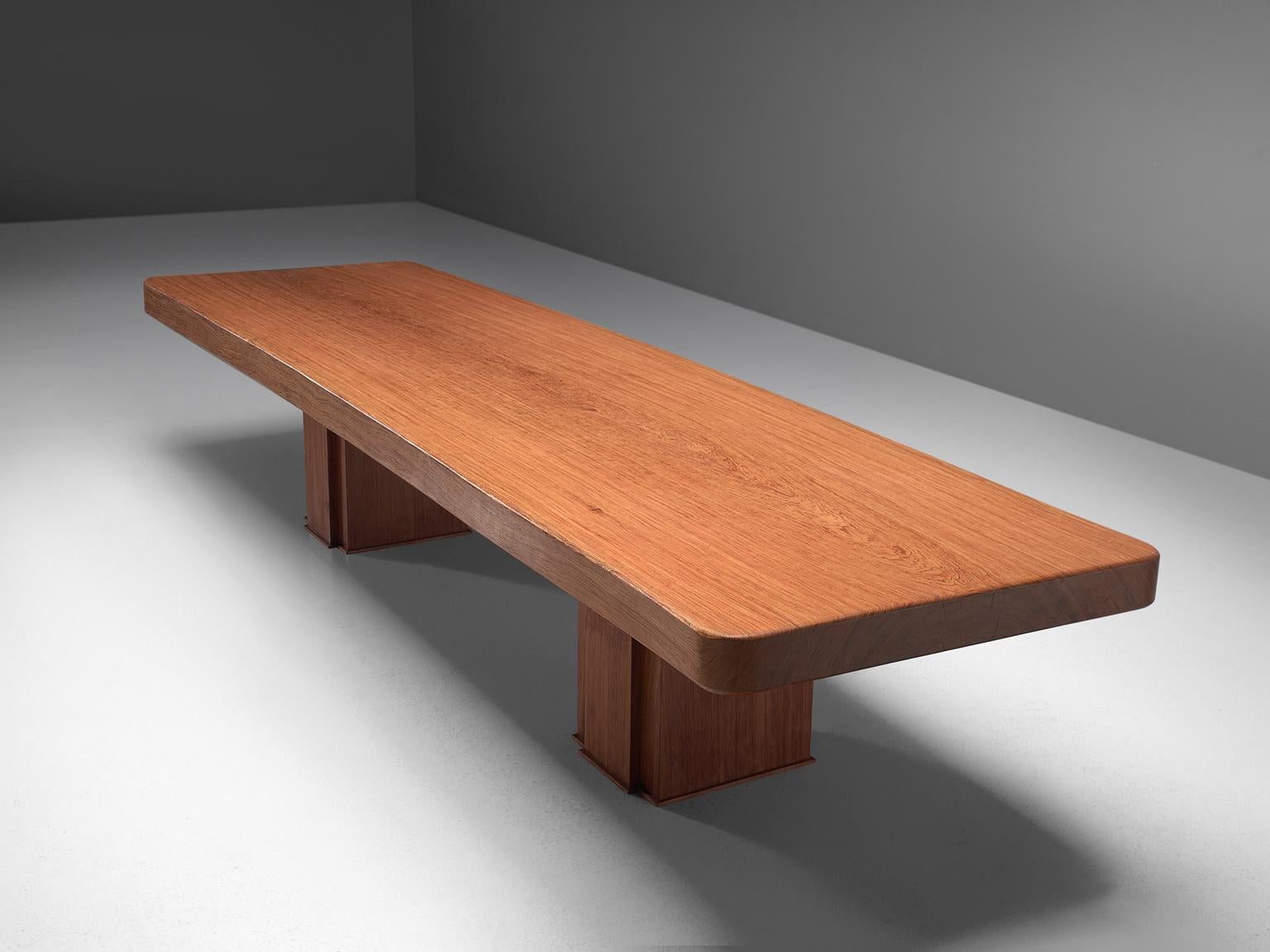 Dining table, bubinga wood, Spain, late 1960s. Measures: 4mtr/ 13ft

Grand conference table made of the rare bubinga wood. This protected African hardwood may be loved as much for its quirky name as it is for its strength and beauty. The 4 meter
