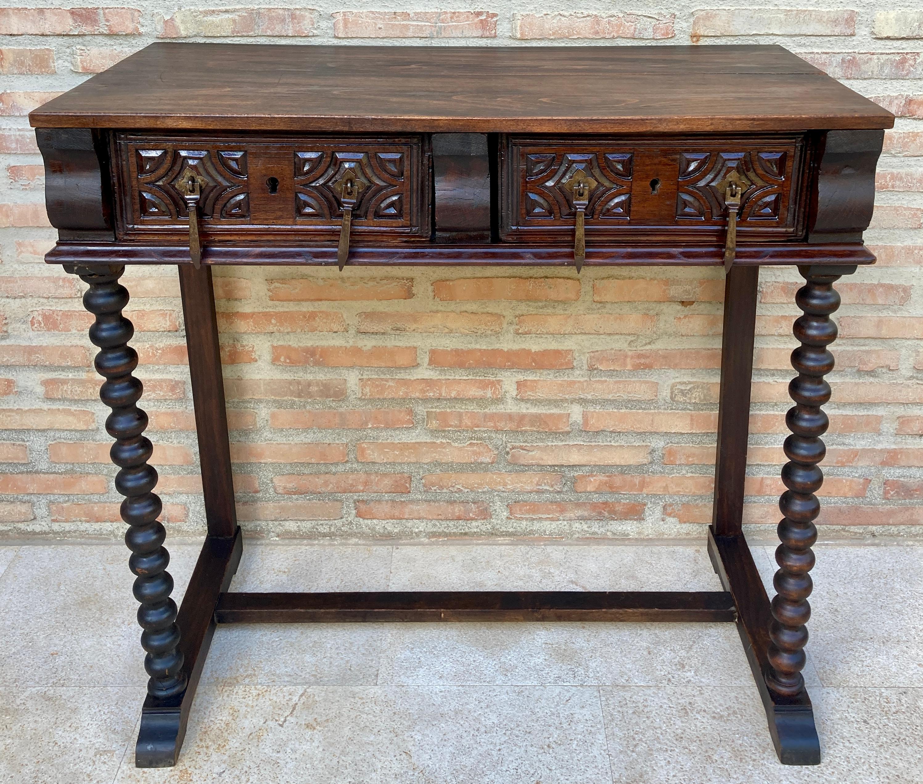 Spanish console table from the 19th century. The rectangular top has two carved drawers, the end legs are beautifully carved.
It can be used as a desk, side table, dresser or console.
Beautiful carved Solomonic legs.