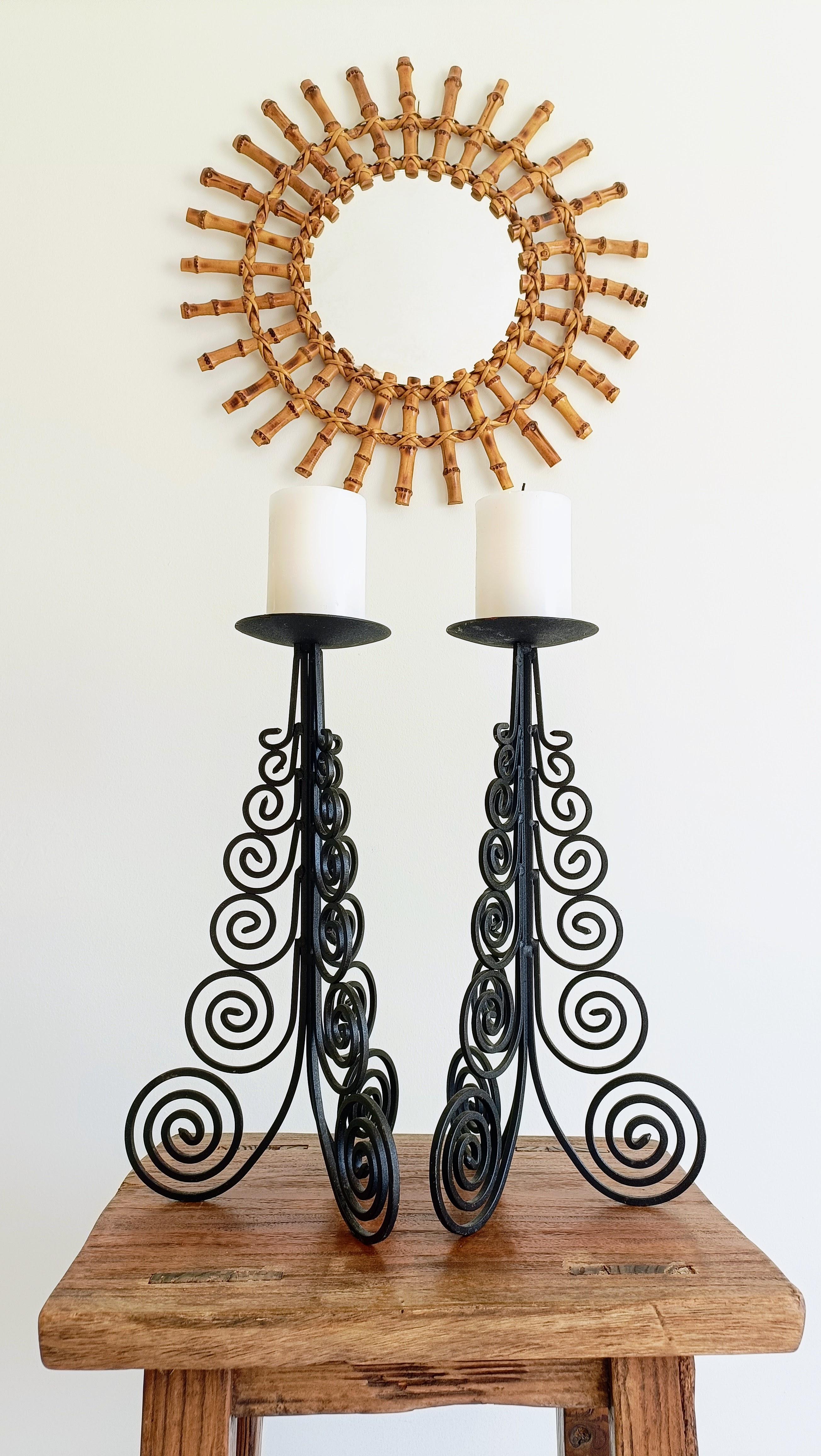 Striking Pair of Large Hand-Forged Spanish Colonial Iron Candelabra, Circa 1970s

A magnificent pair of large hand-forged black iron candelabra, inspired by the timeless elegance of Spanish Baroque design. These pieces draw from the rich tradition