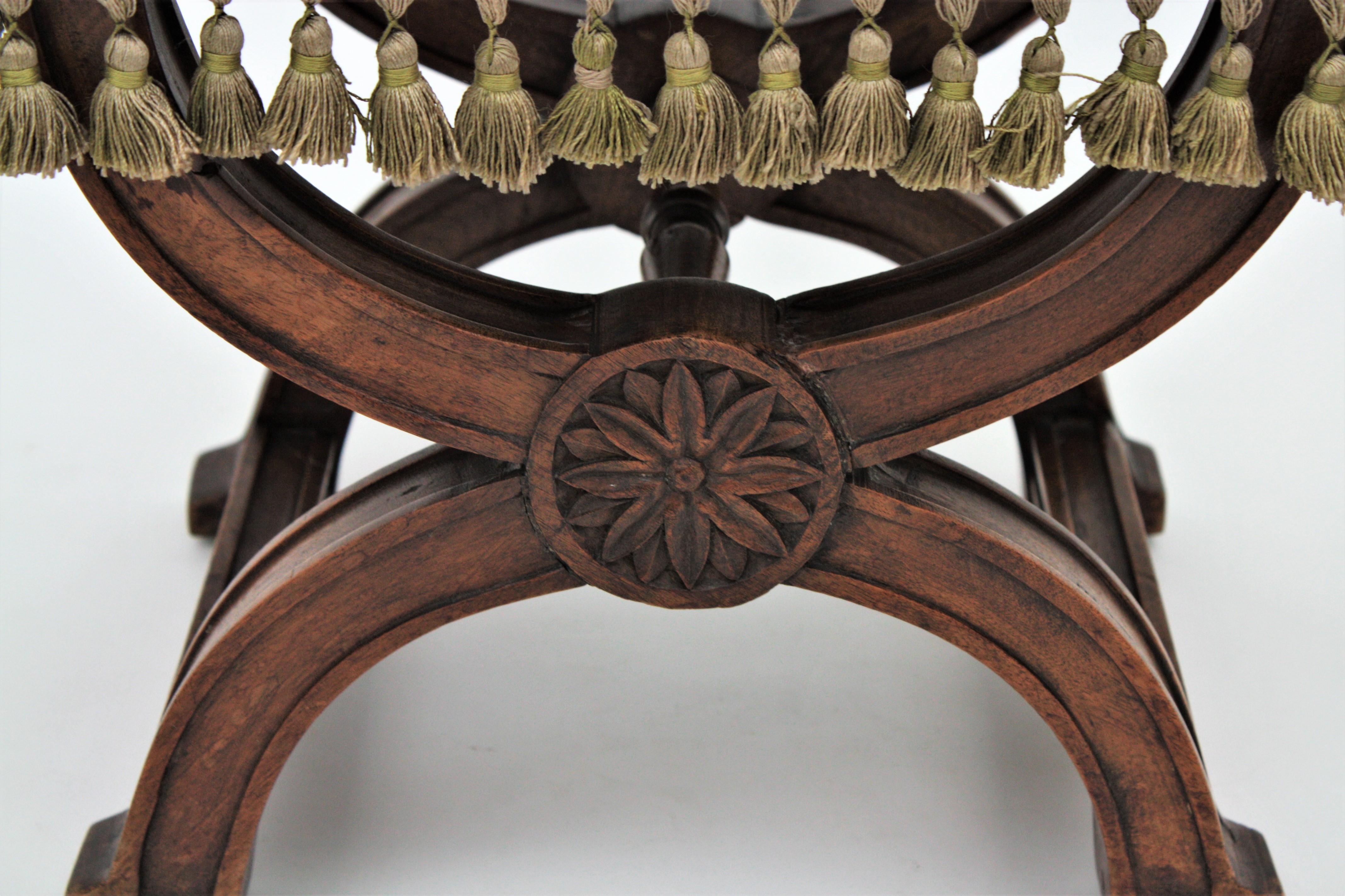 Hand-Carved Spanish Curule Stool in Wanut and Green Velvet Upholstery For Sale