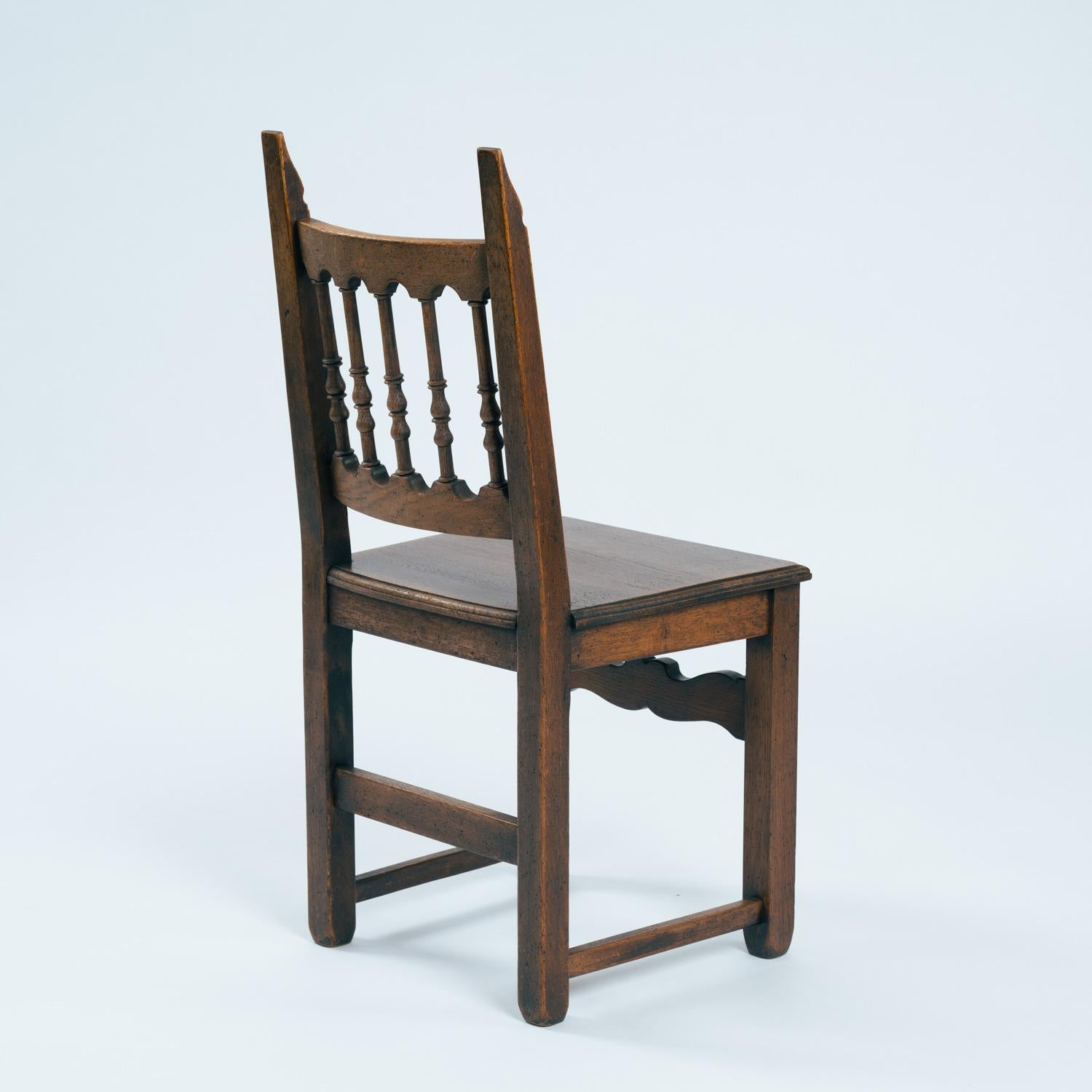 Intagliato a mano Spanish carved walnut wooden dining chairs, 1970s in vendita