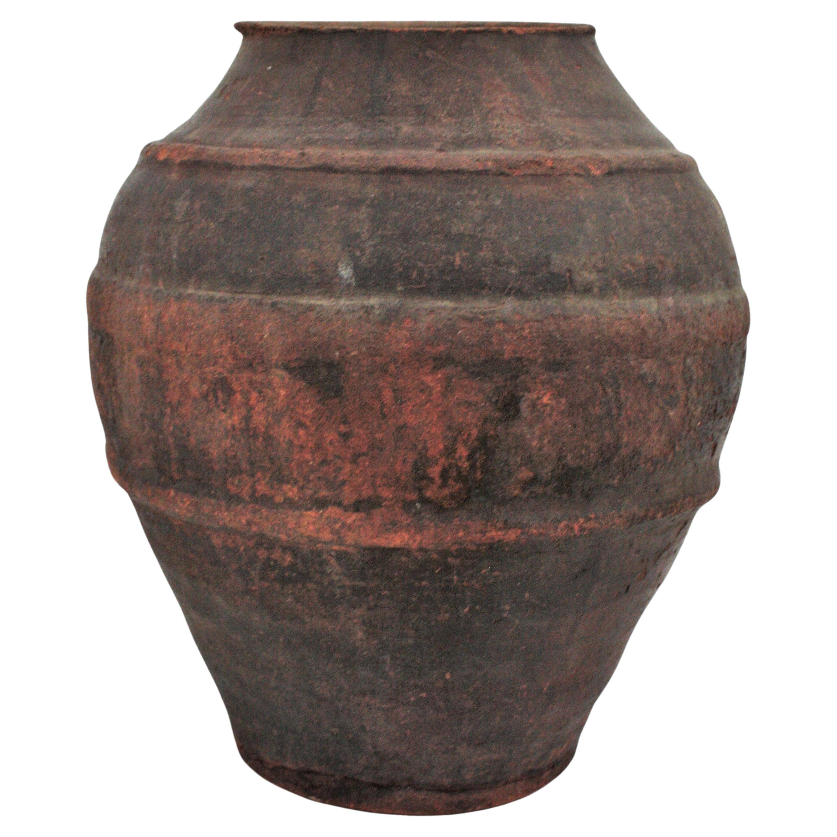 Antique Handmade Unglazed Terracota Olive Jar or Vessel, Spain, 19th century- 1930s
This eye-catching dark terracota jar or urn was designed to contain water and to keep it fresh. It has distinctive decorative bands and a terrific aged