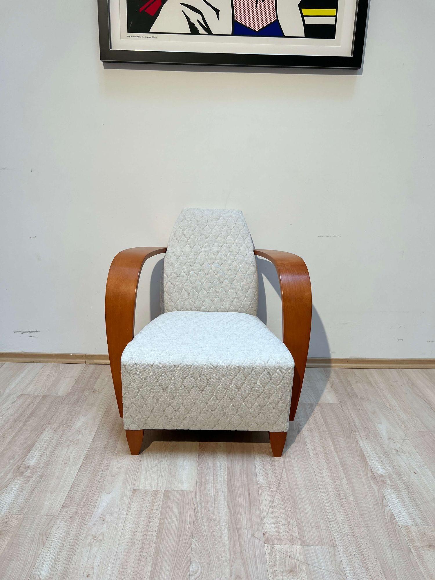 Elegant vintage design armchair, club or lounge chair from Spain, late 1990s.
Manufacturer: Andreu World SA, Spain.
Strongly curved, high armrests in beech plywood. Conical legs in solid beech. Solid beech frame.
Newly upholstered with cream-white
