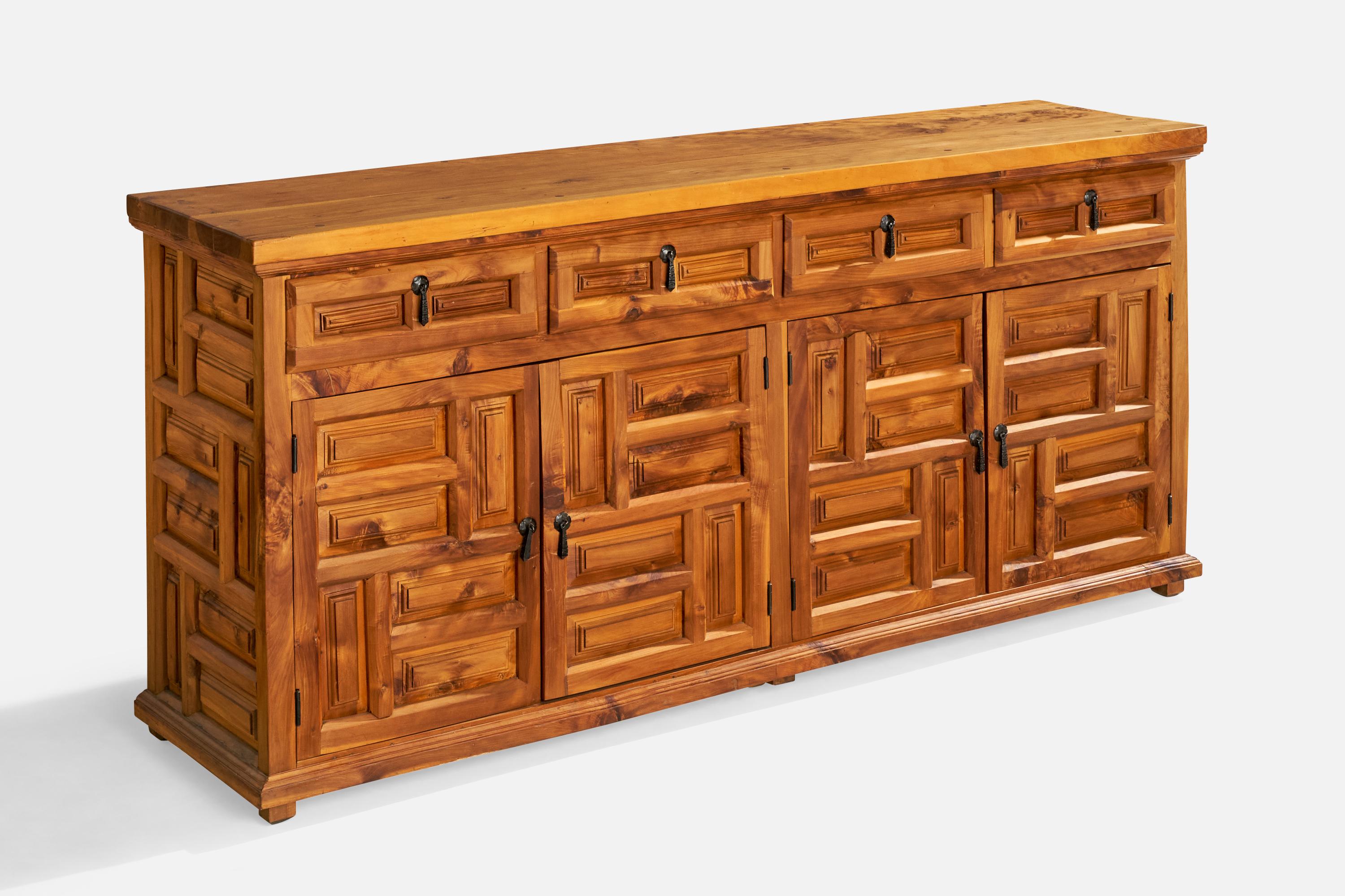 A cypress wood and iron cabinet designed and produced in Spain, c. 1970s.

Dimensions: 35.25” H x 76.625“ W x 18.875” D